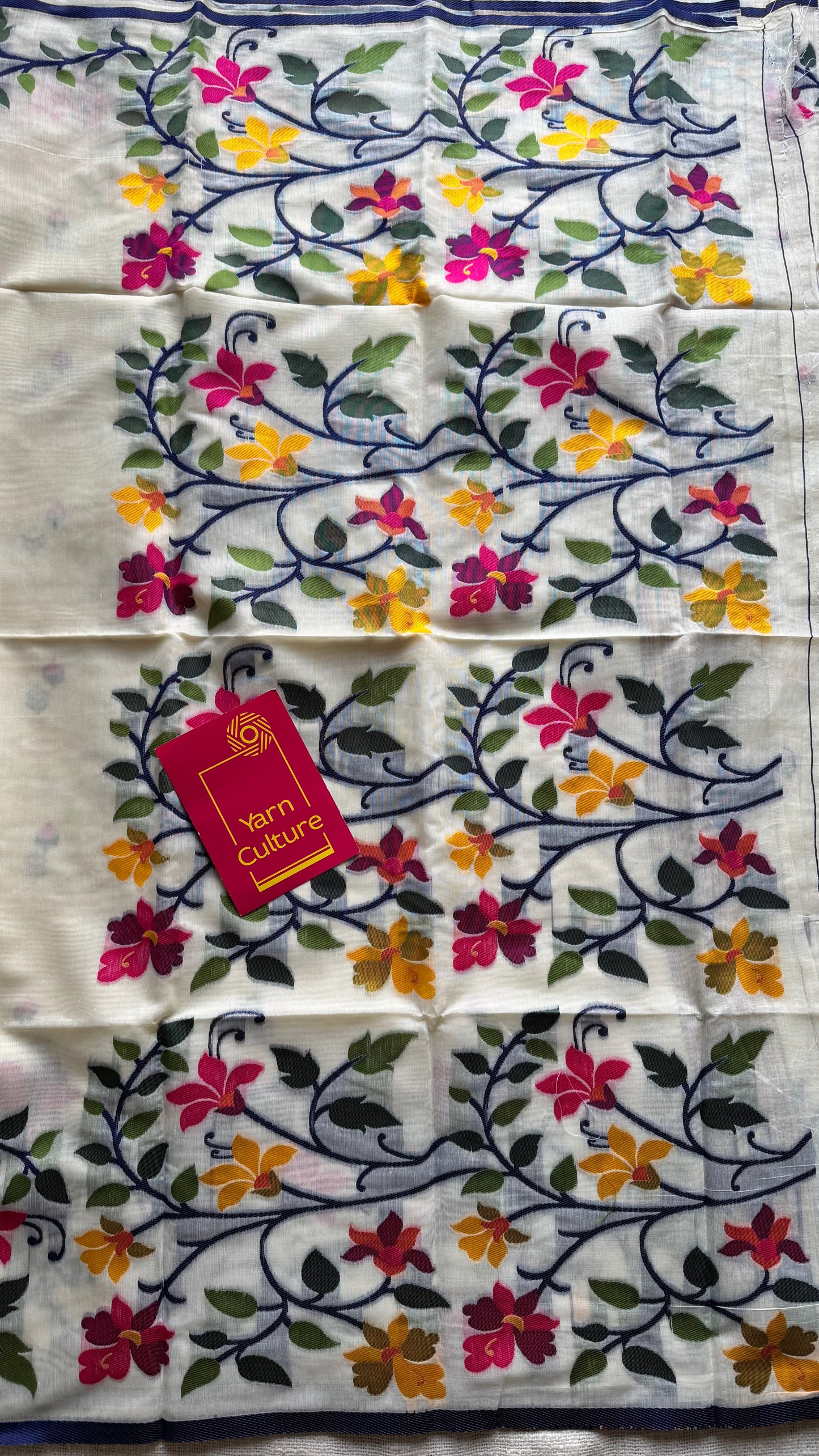 Ivory with navy blue border and multicolour floral motifs, cotton saree - YCIEBCFE325