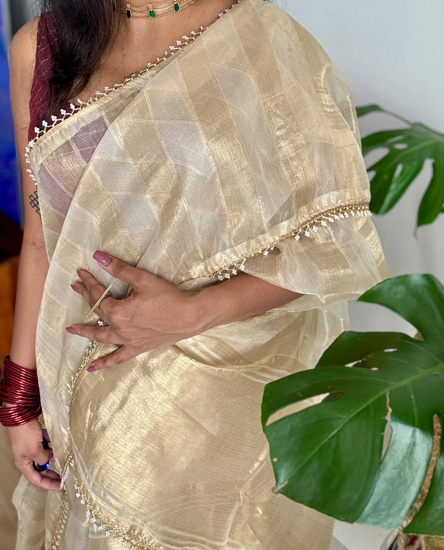 Gold soft semi tissue saree, striped body, pearl embellished border - YCIEON83