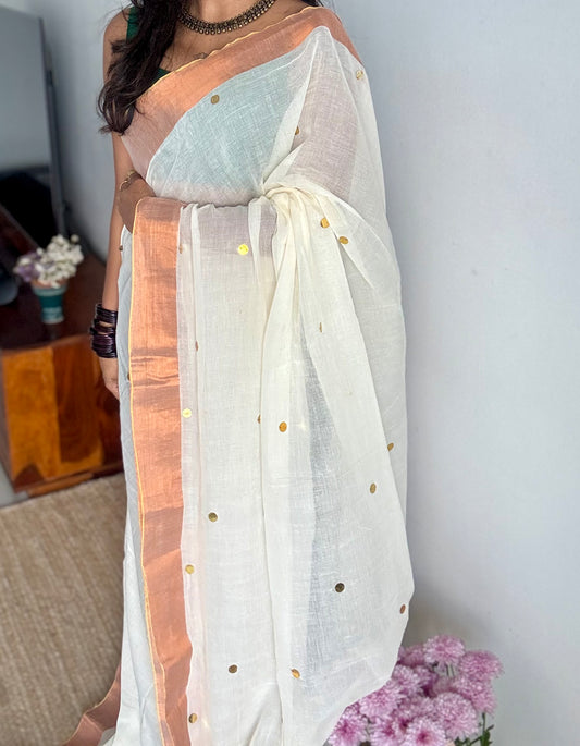 Ivory mul with gini sequins and copper zari border - YCBCMCNO60