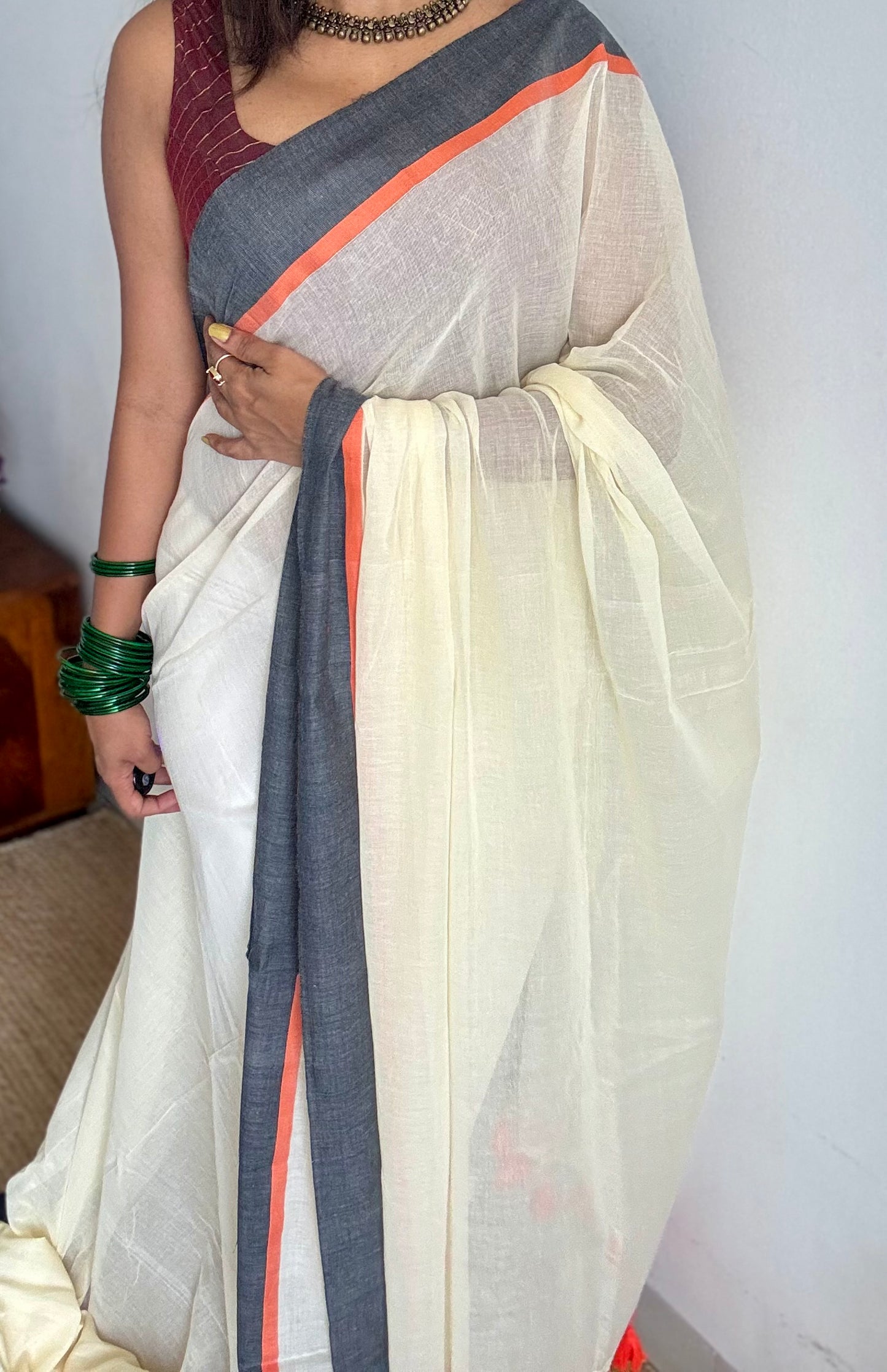 Ivory mul saree with black and orange border - YCBCMCFE293