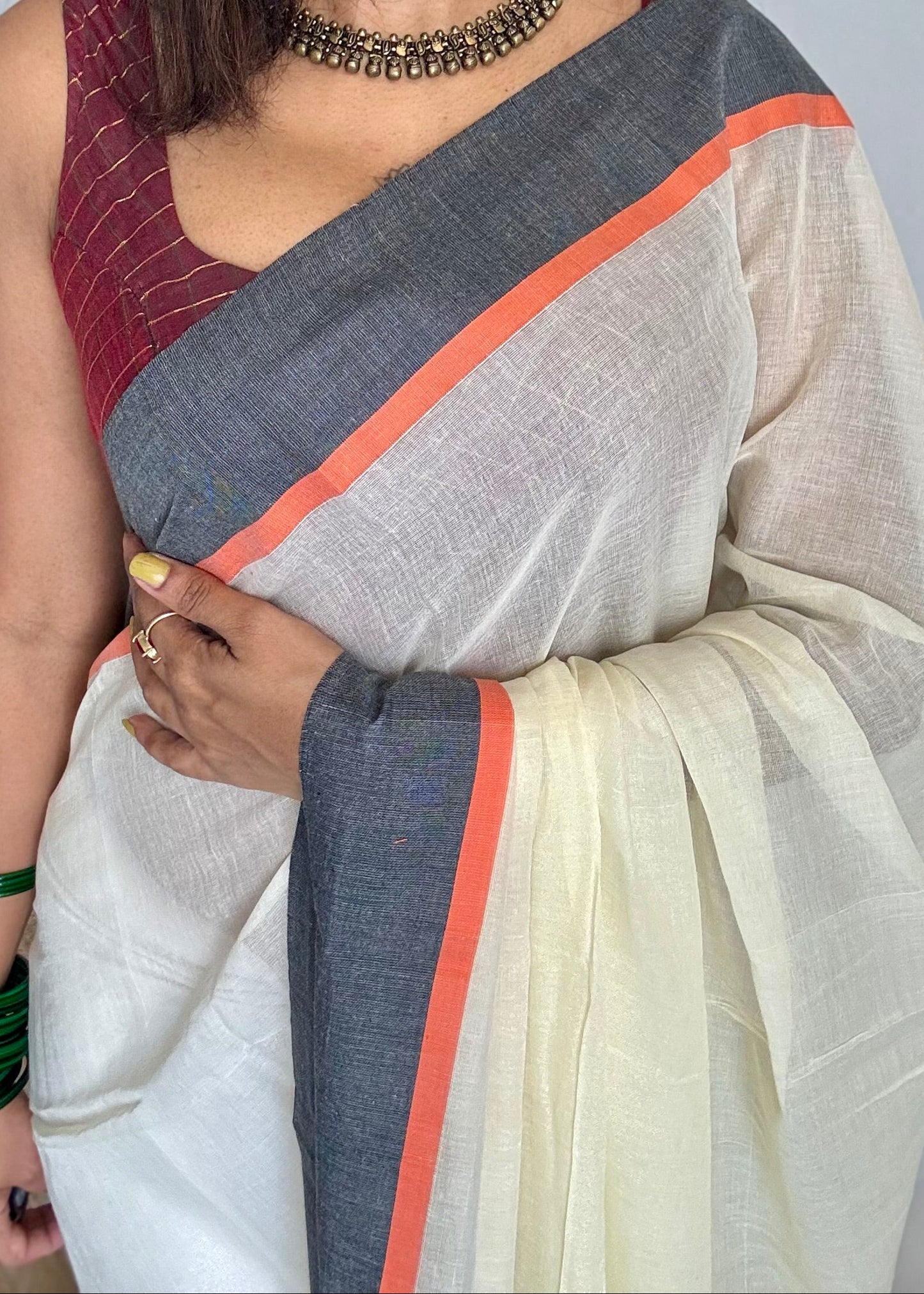 Ivory mul saree with black and orange border - YCBCMCFE293