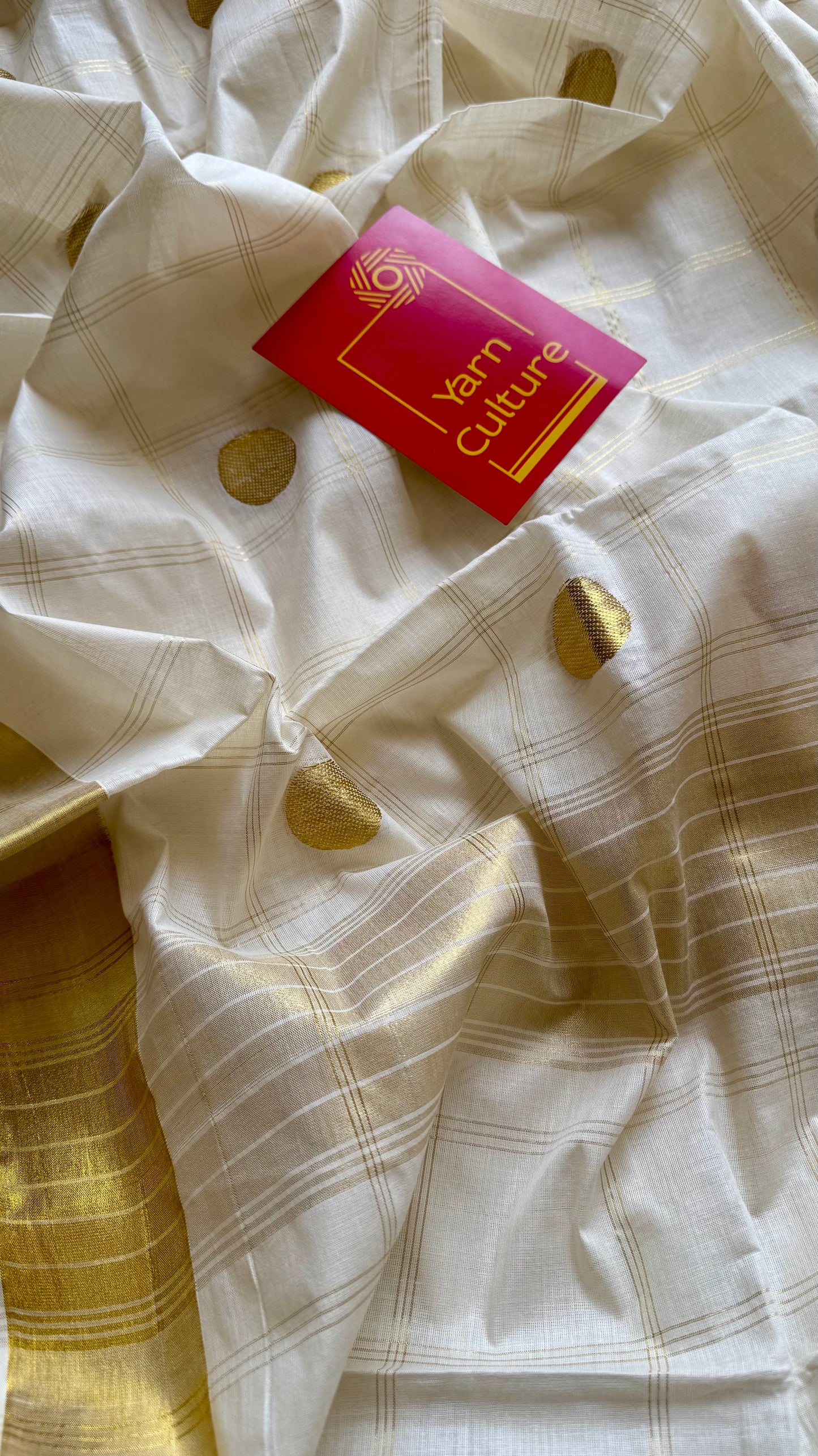 Ivory and gold kerala saree with gold buttas and checks - YCIEON41