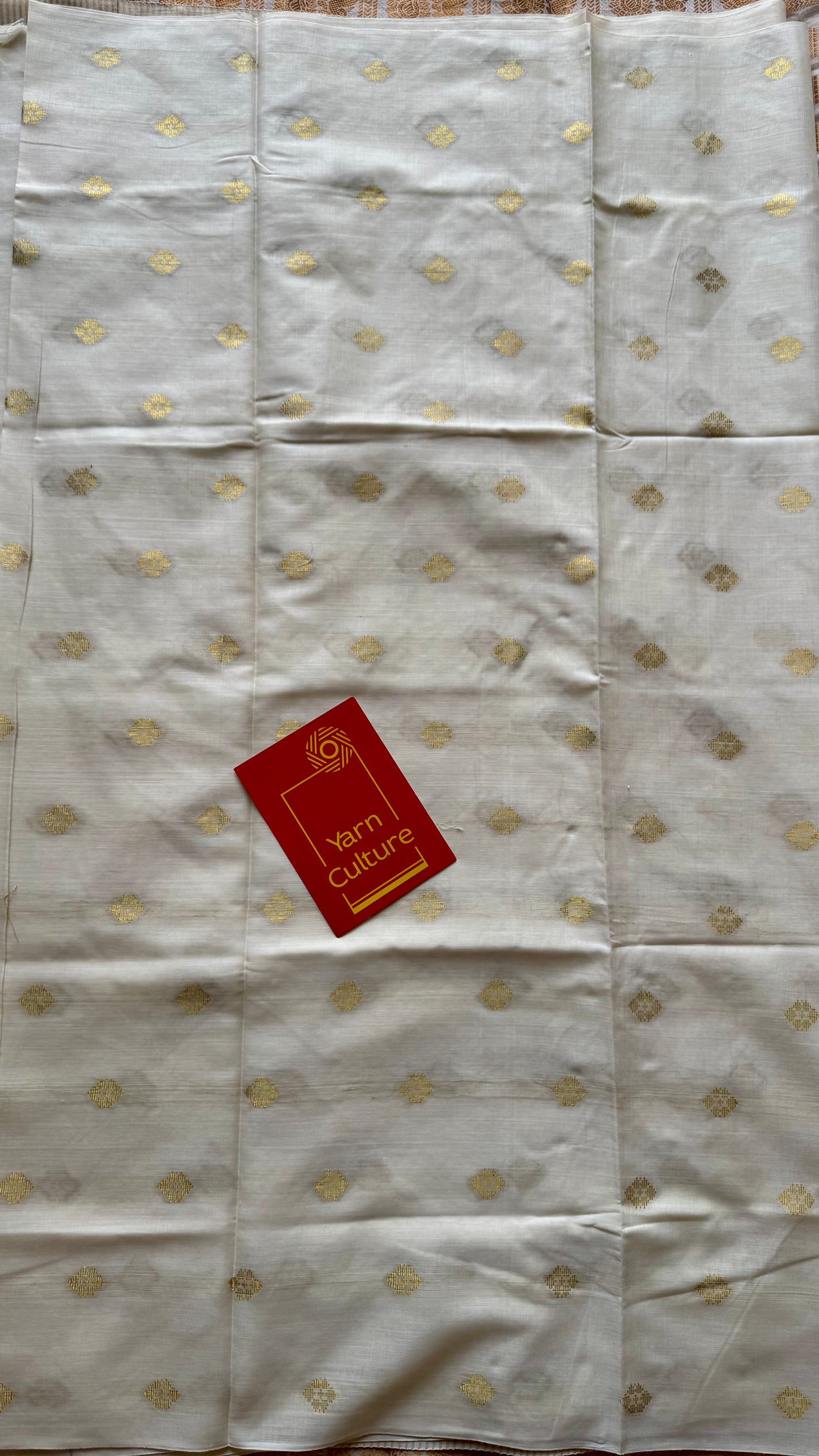 Ivory and gold kerala saree with woven buttas, striped pallu - YCIEON43