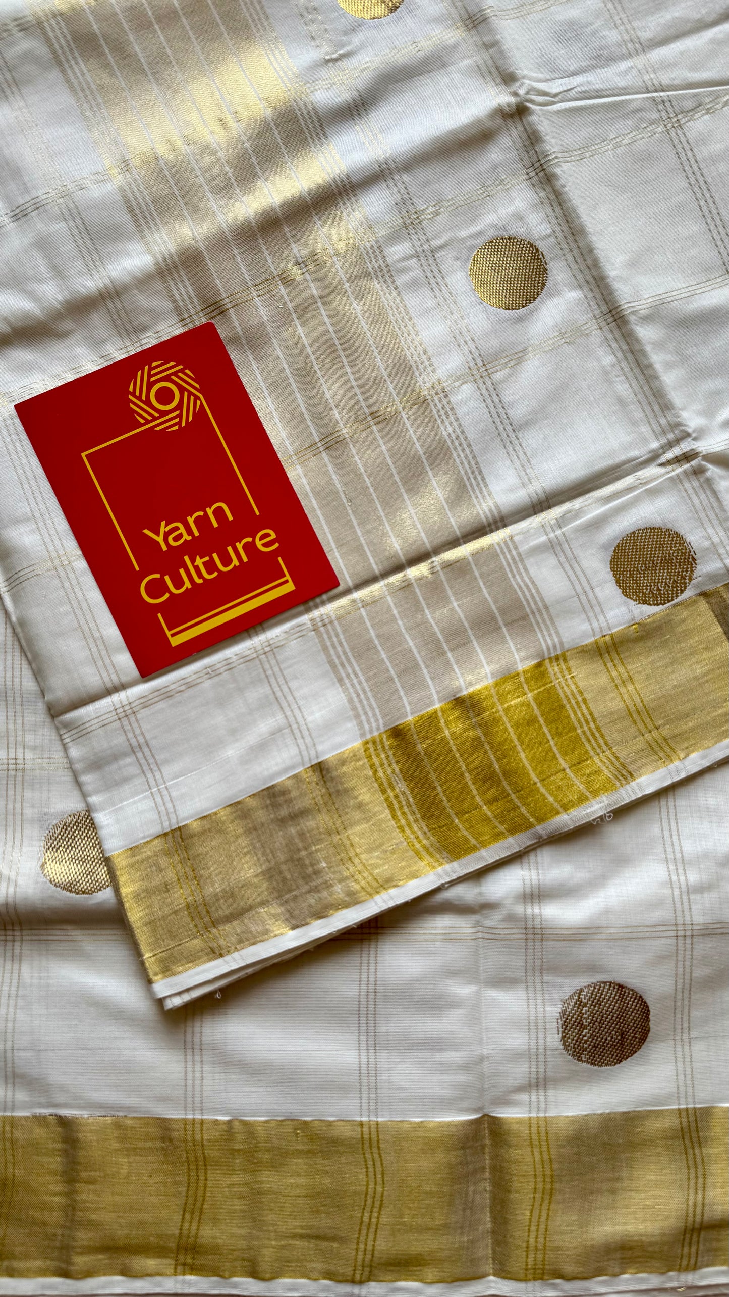Ivory and gold kerala saree with gold buttas and checks - YCIEON41
