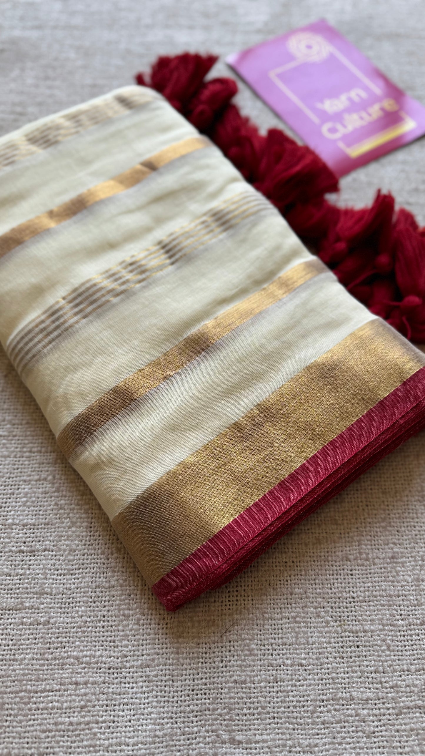 Ivory mul saree with gold stripes and red border - YCIEBCFE327