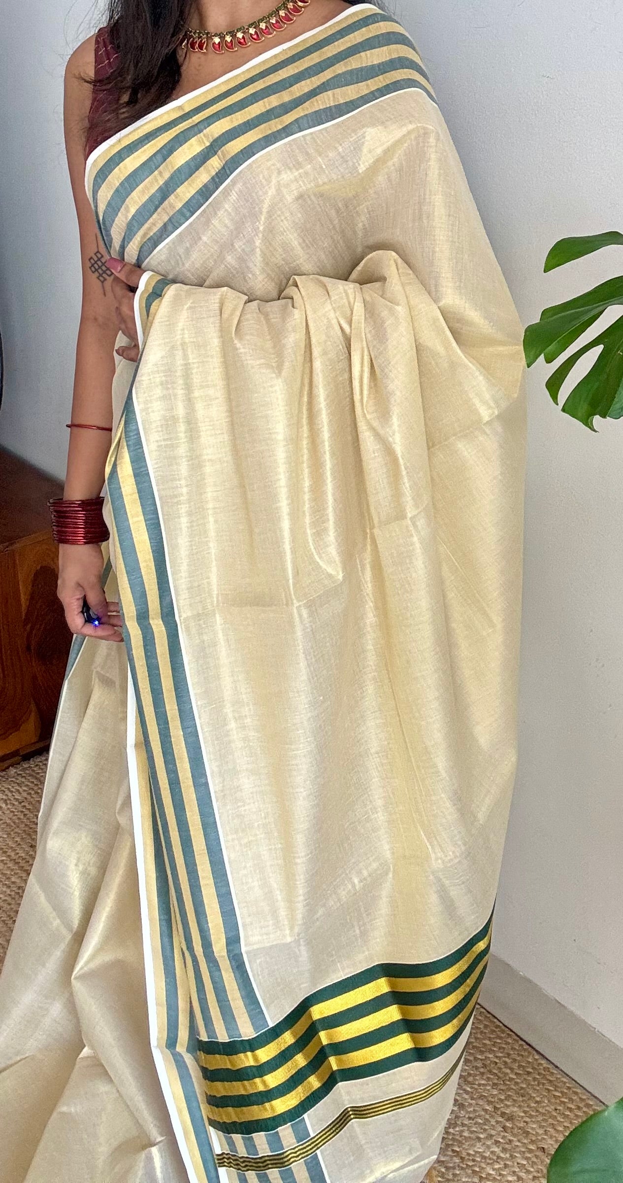 Ivory and gold soft tissue cotton saree, dark green border - YCIEON68