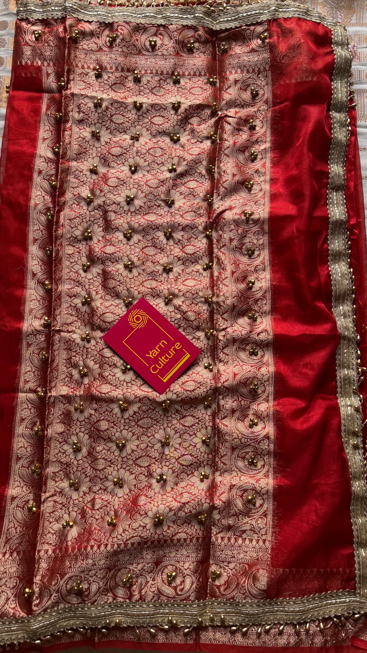 Red gold tissue Banarasi saree with ghungroo embellishments and beaded lace zari border - YCBLTOC69