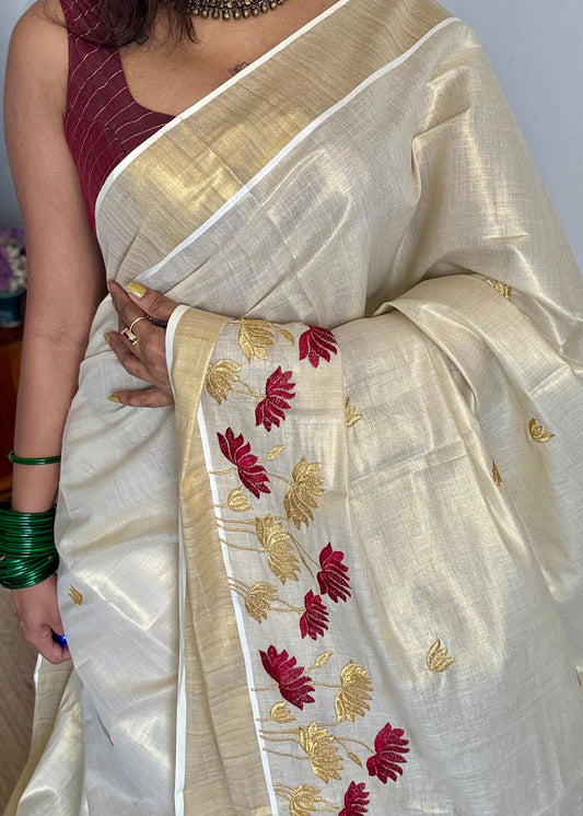 Ivory and gold tissue kerala cotton saree with maroon and gold lotus embroidery - YCIEKCFE316