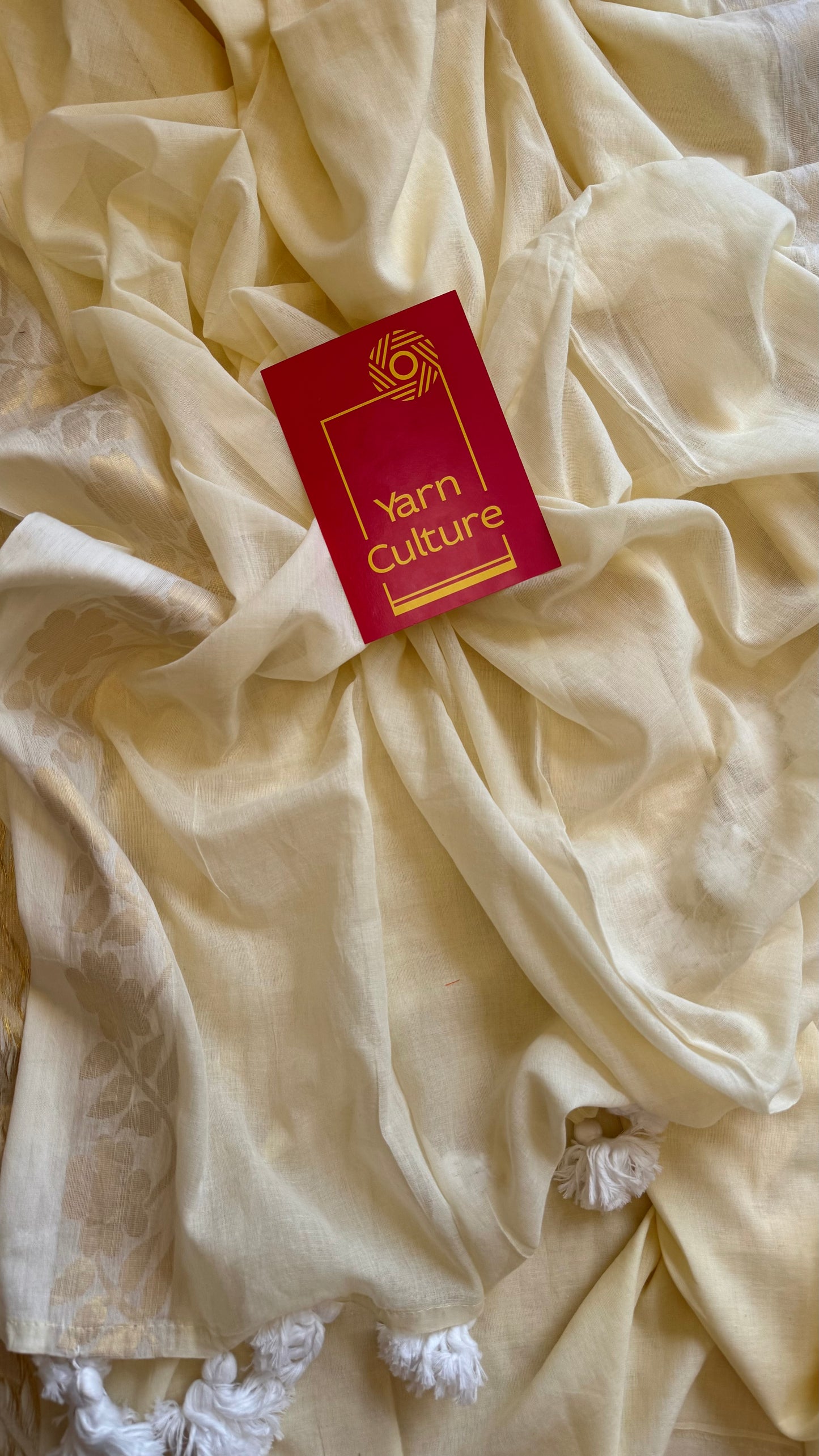Ivory mul saree, zari flowers on border - YCIEON22