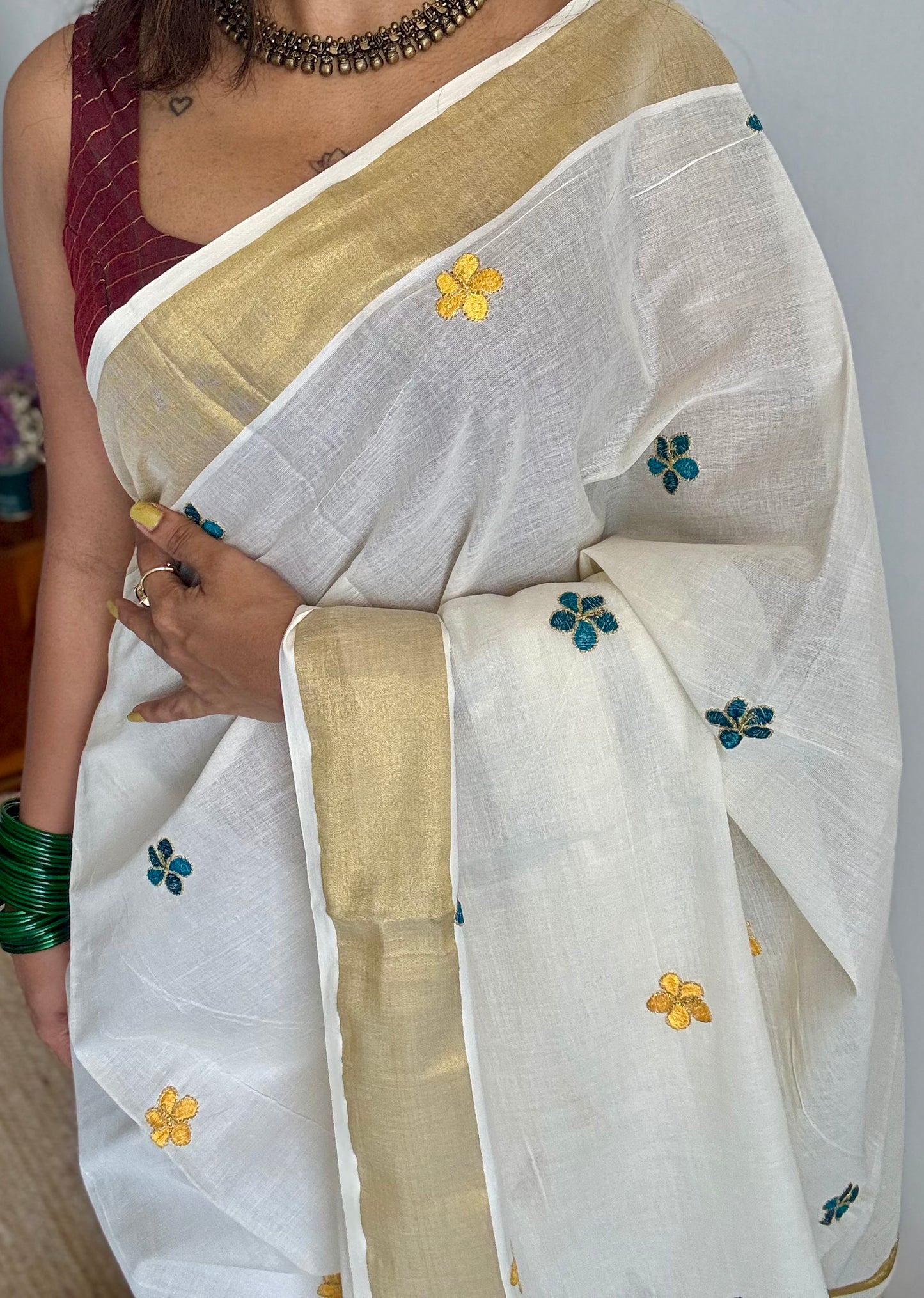 Ivory and gold saree with peacock blue and yellow floral embroidery - YCIEKCFE309