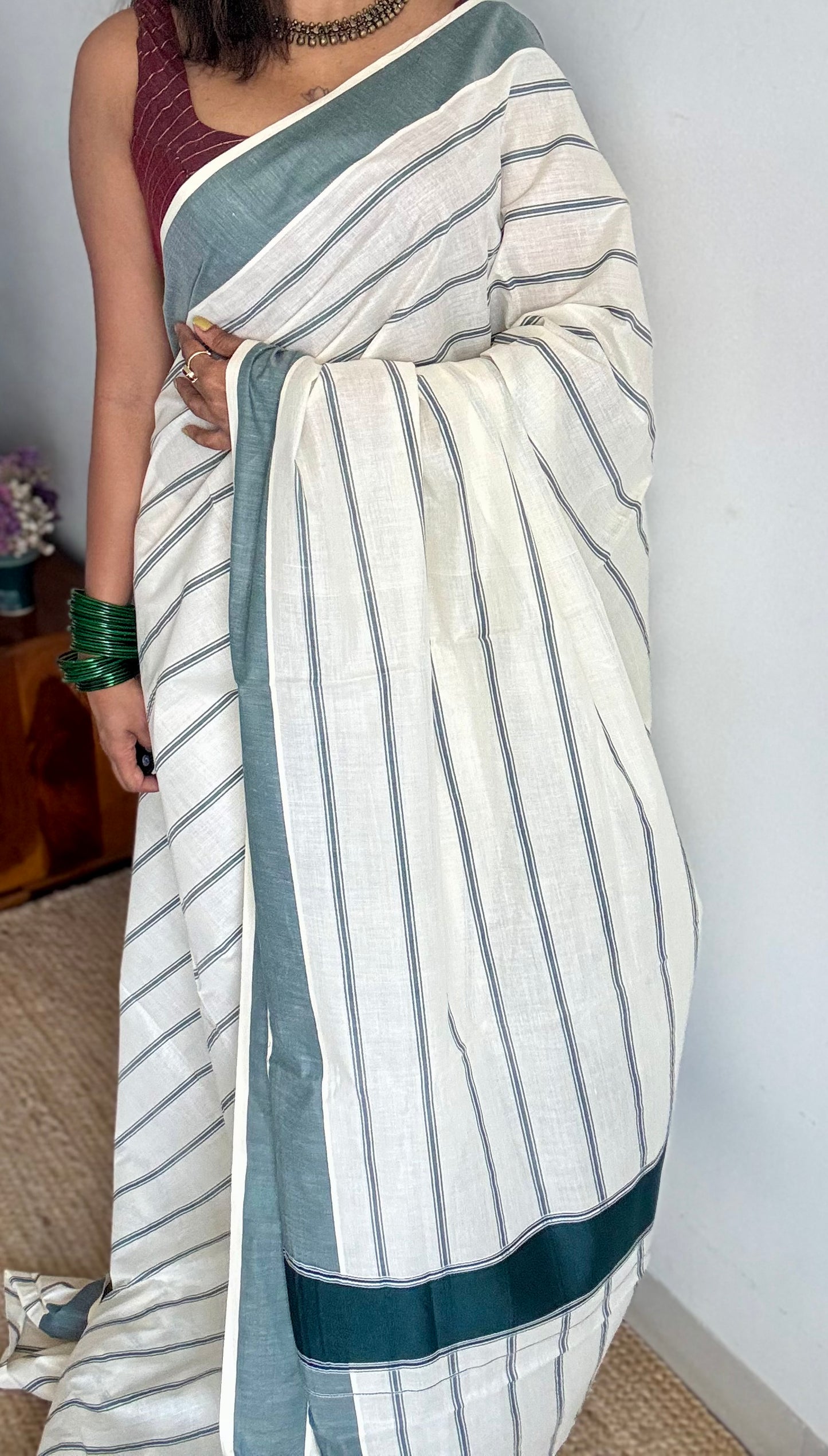 Ivory Kerala cotton saree with green stripes and border - YCIEKCFE323