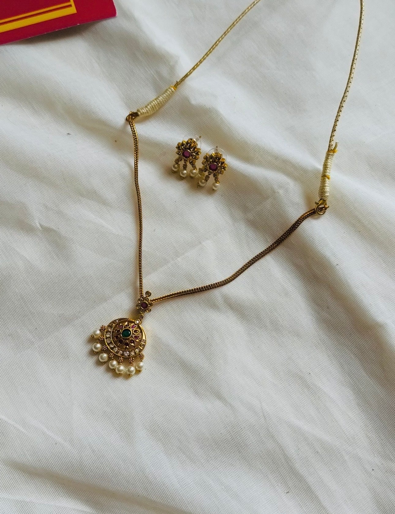 Attigai with ruby, green and white round pendant neckpiece, with earrings - YCGPNP787