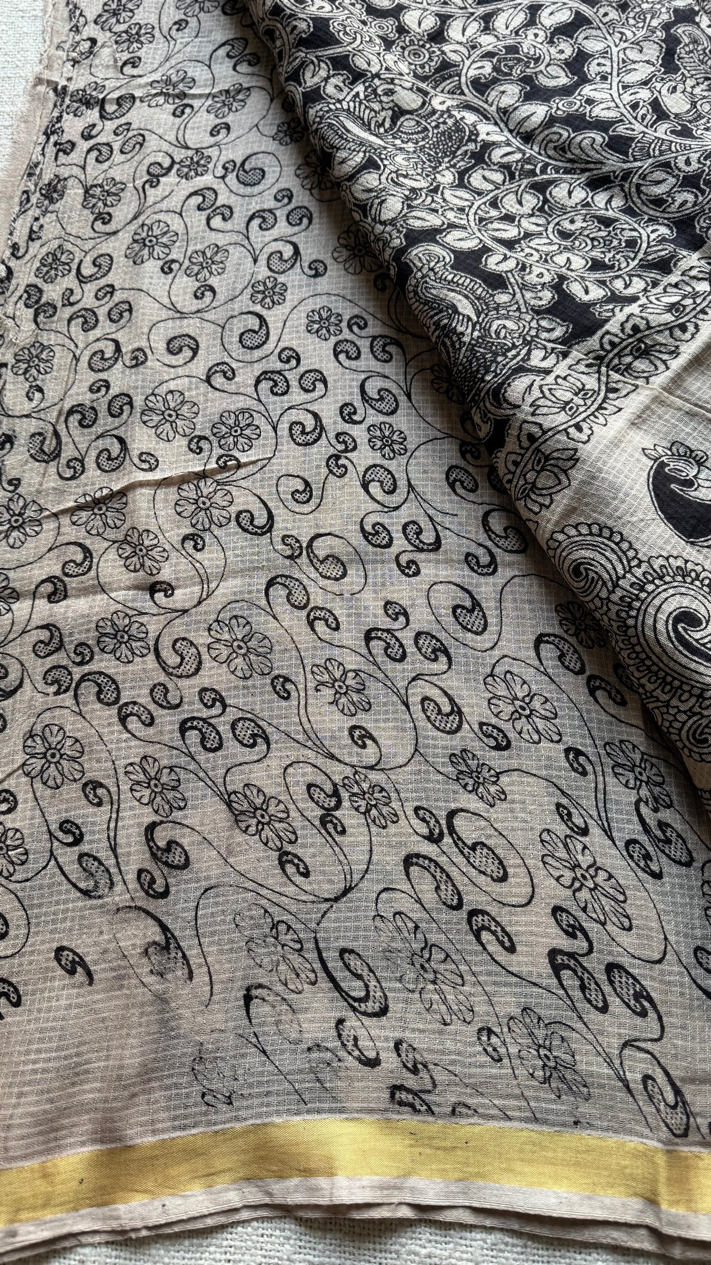 Black cream floral kalamkari saree in kota, with zari border - YCWOTDKKFE19