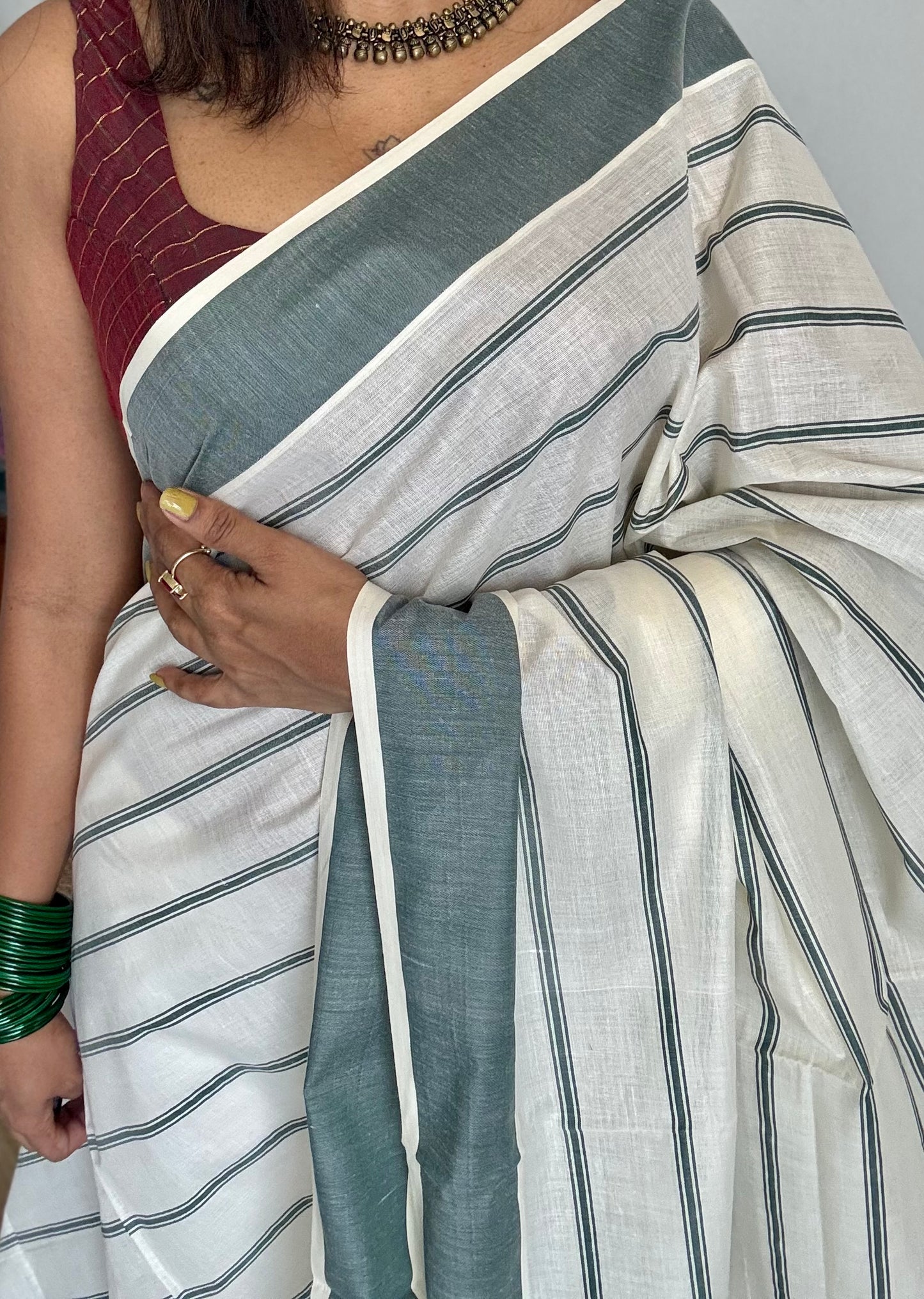 Ivory Kerala cotton saree with green stripes and border - YCIEKCFE323