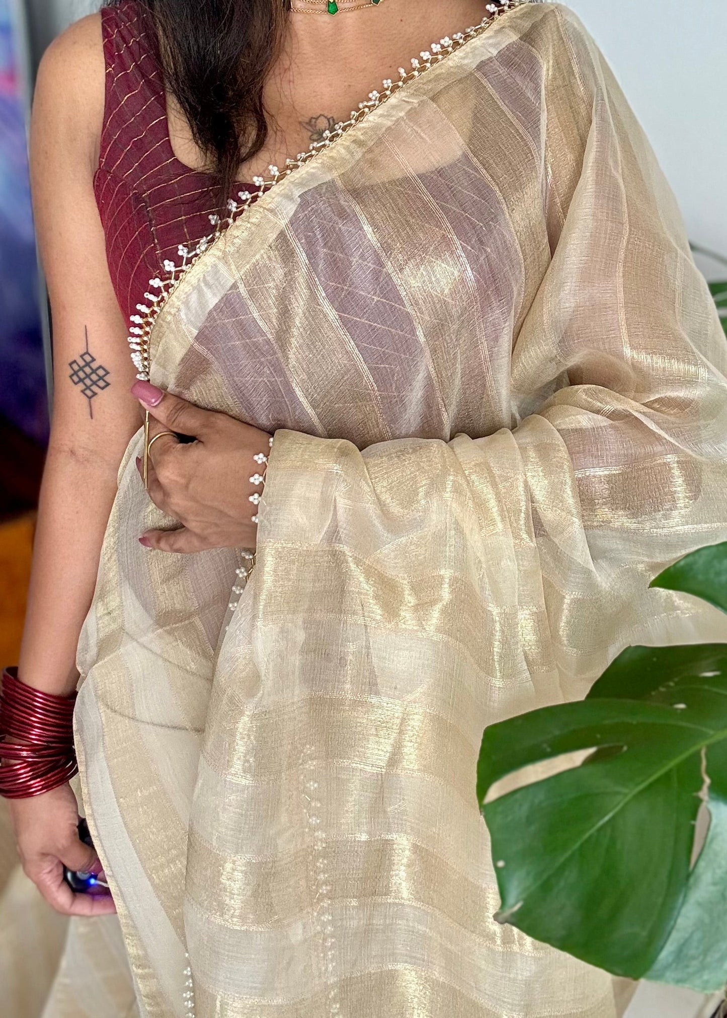 Gold soft semi tissue saree, striped body, pearl embellished border - YCIEON83