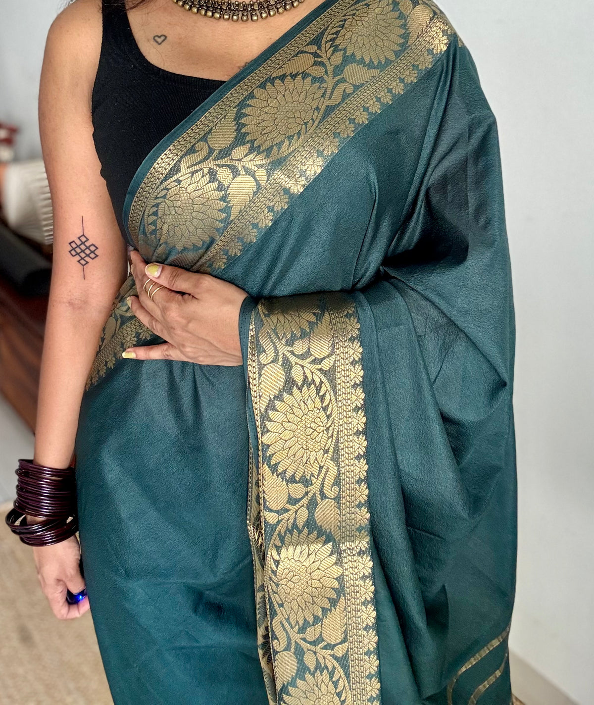 Dark green, semi crepe silk saree with antique gold floral border - YCLOKOC57