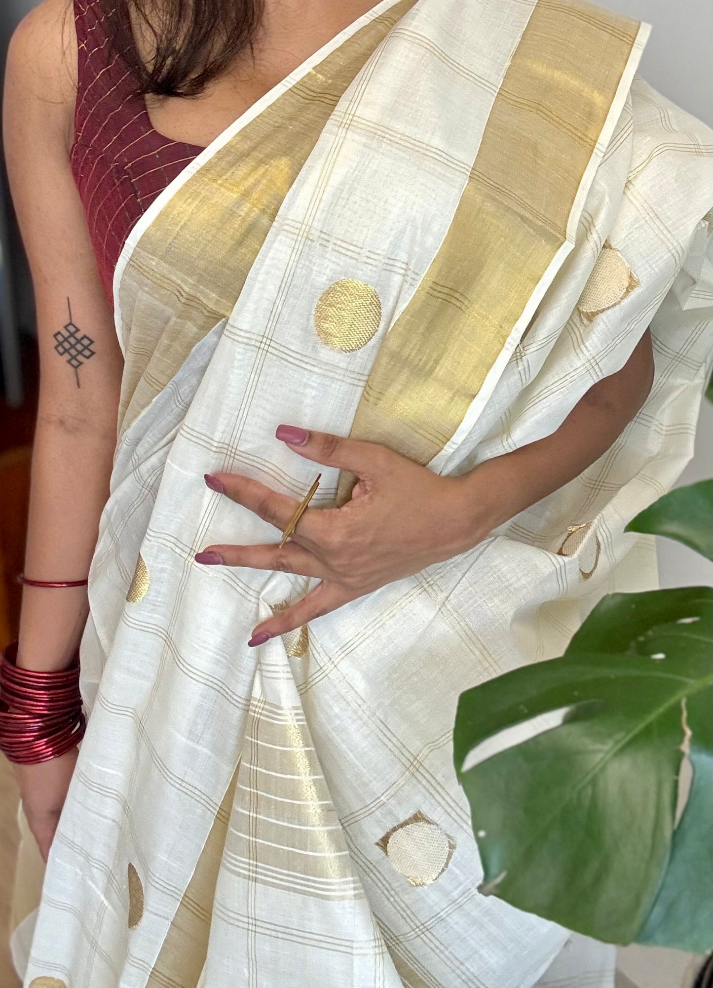 Ivory and gold kerala saree with gold buttas and checks - YCIEON41