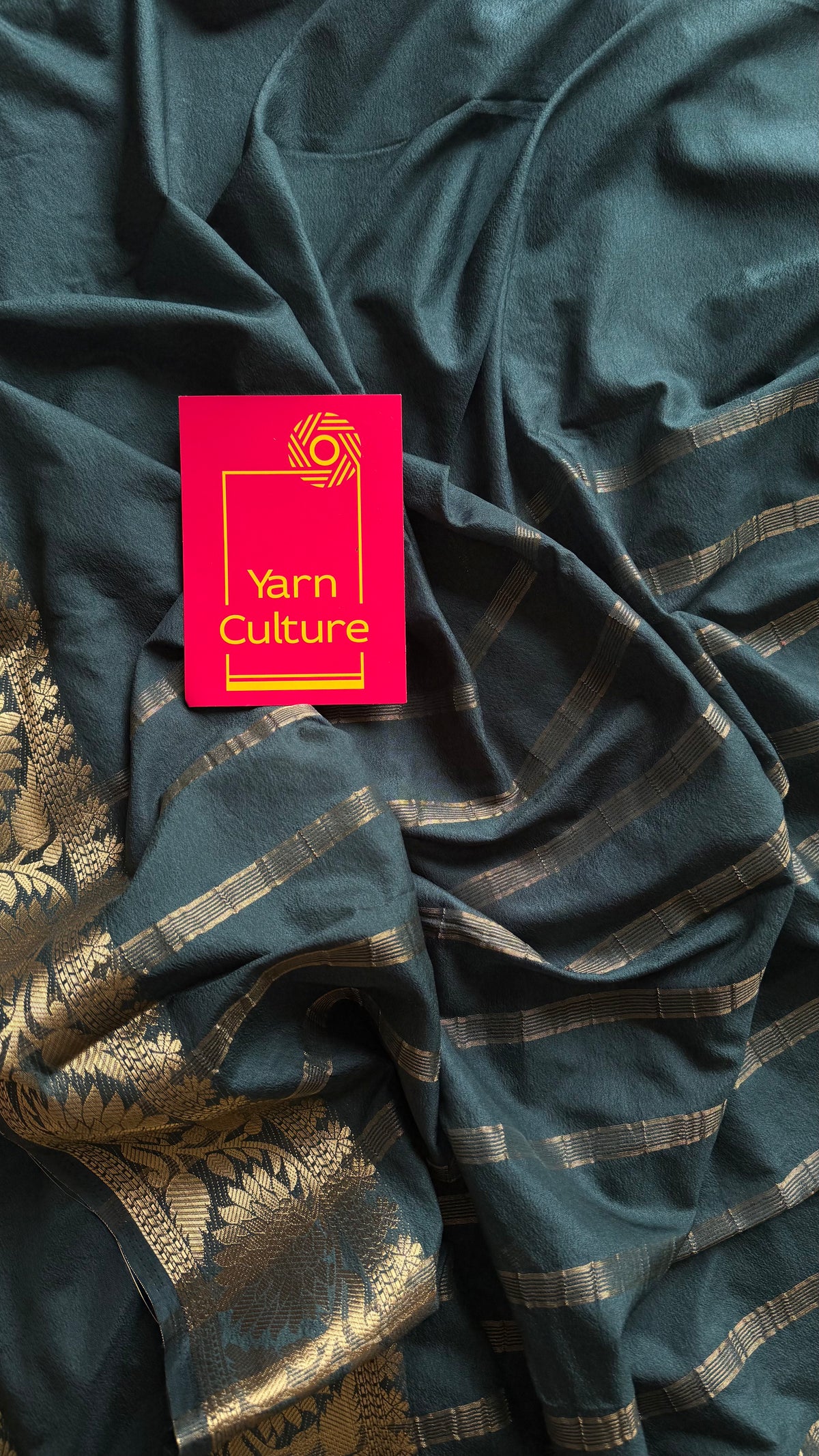 Dark green, semi crepe silk saree with antique gold floral border - YCLOKOC57