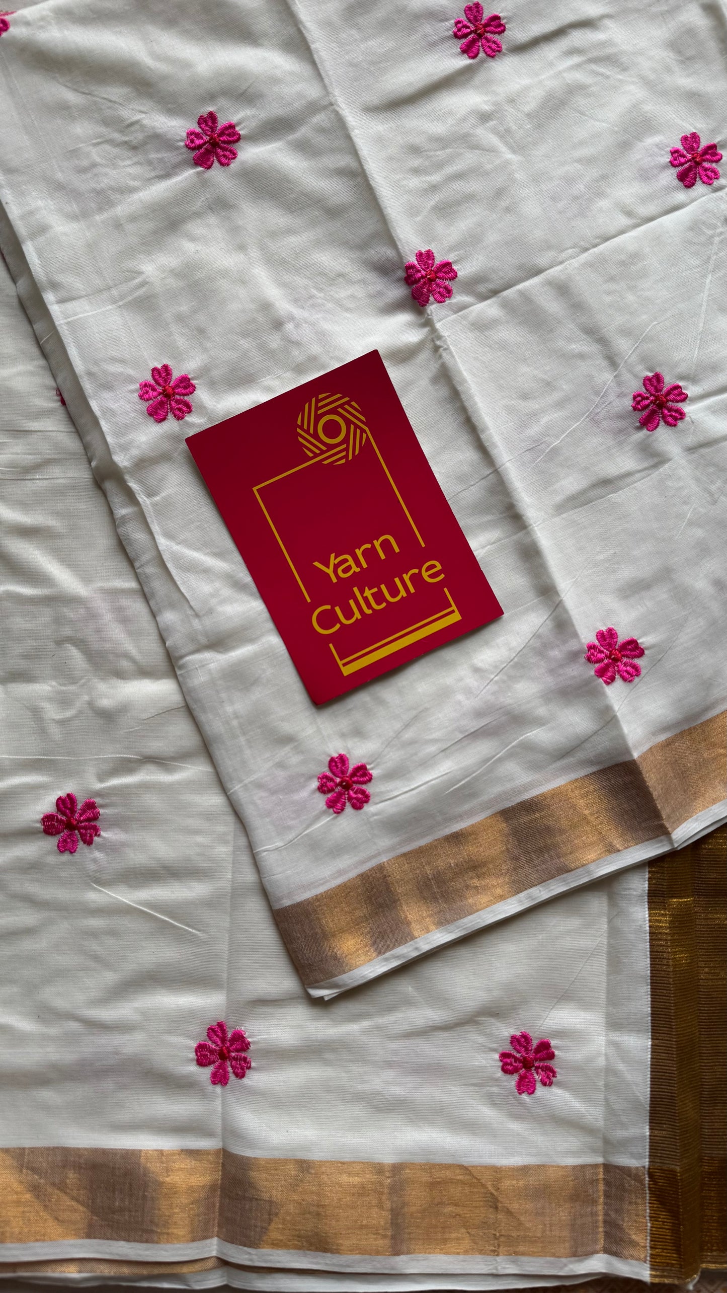 Ivory and antique gold soft cotton kasavu saree, pink parijat floral embroidery - YCIEON155