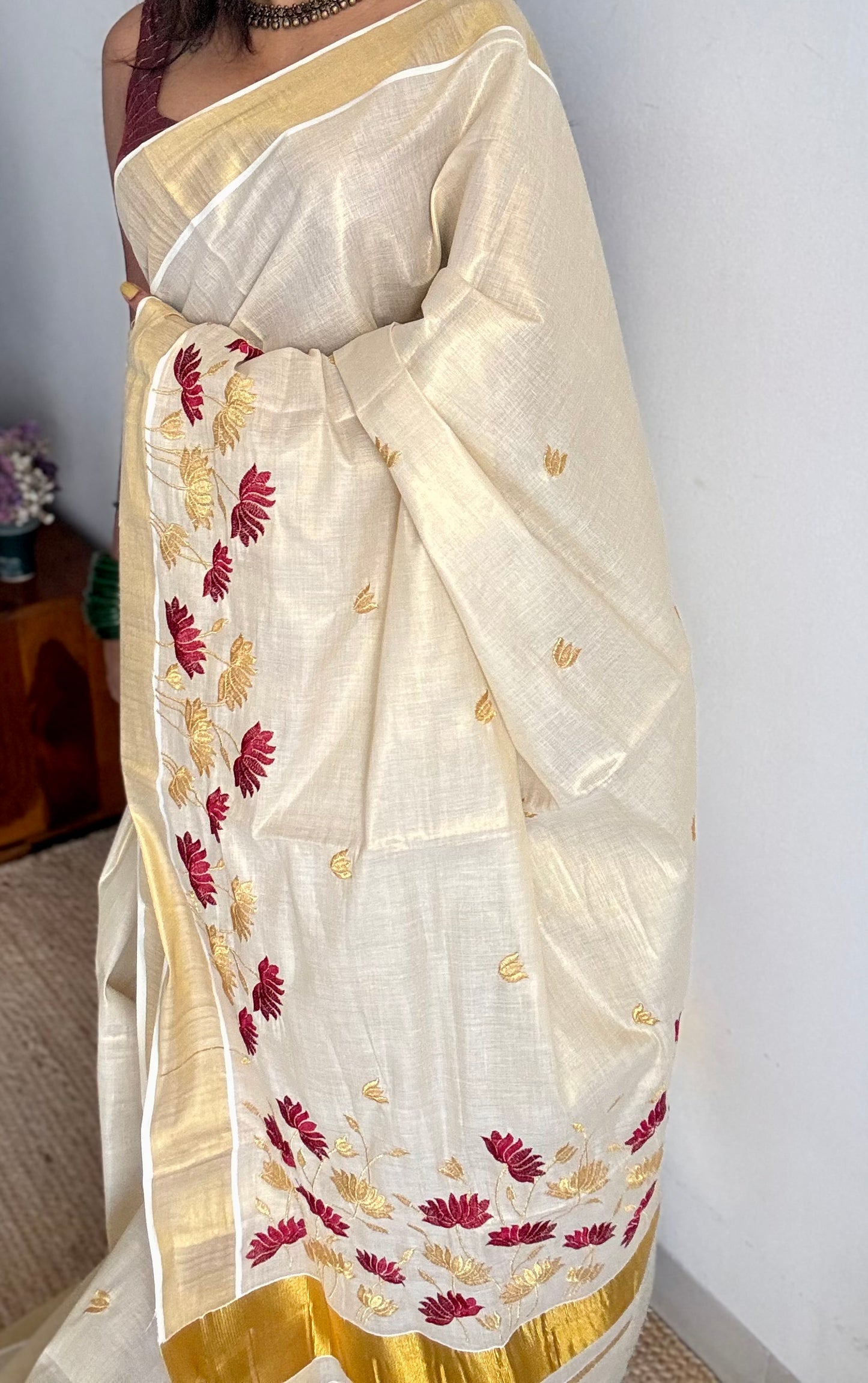 Ivory and gold tissue kerala cotton saree with maroon and gold lotus embroidery - YCIEKCFE316