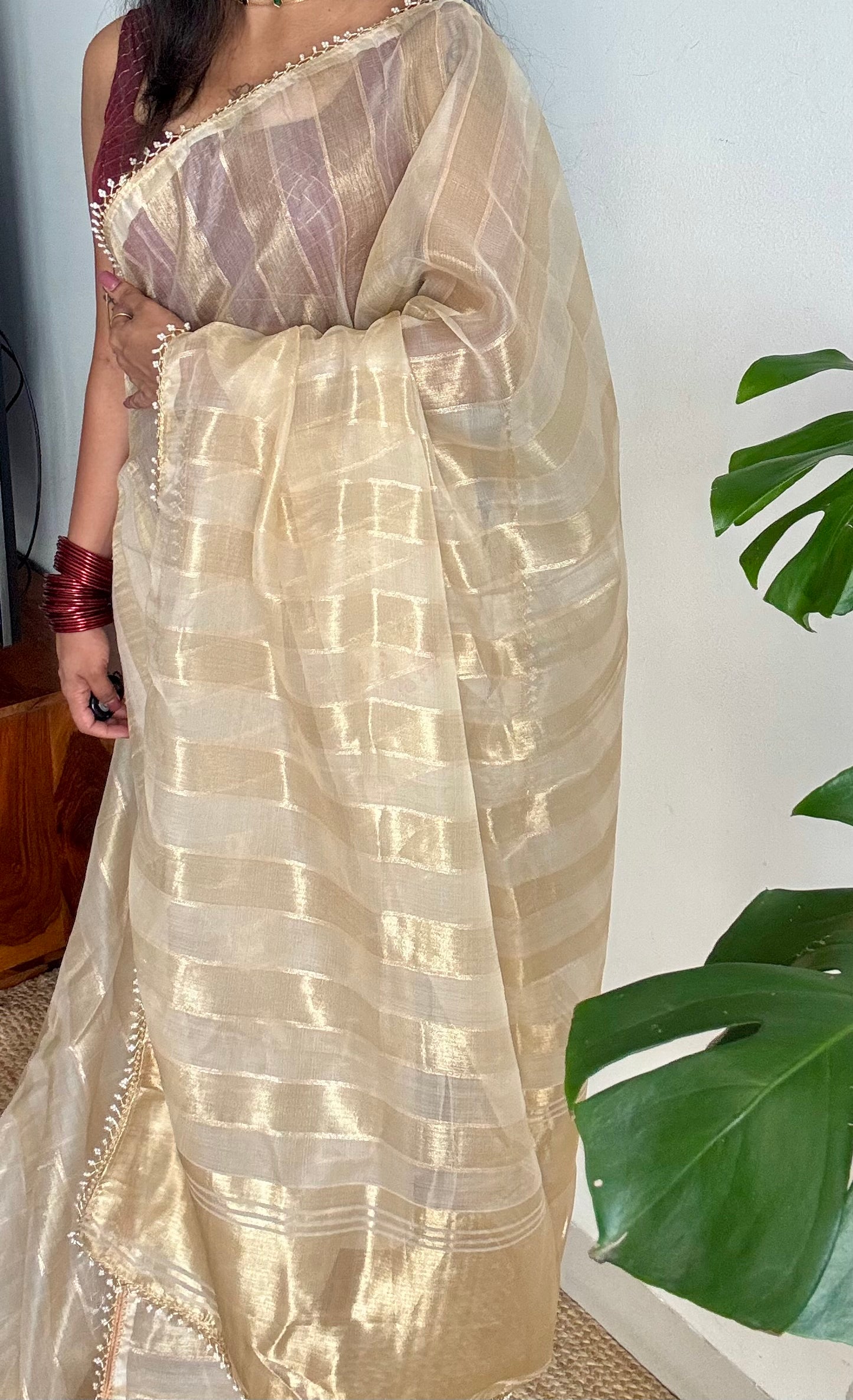 Gold soft semi tissue saree, striped body, pearl embellished border - YCIEON83