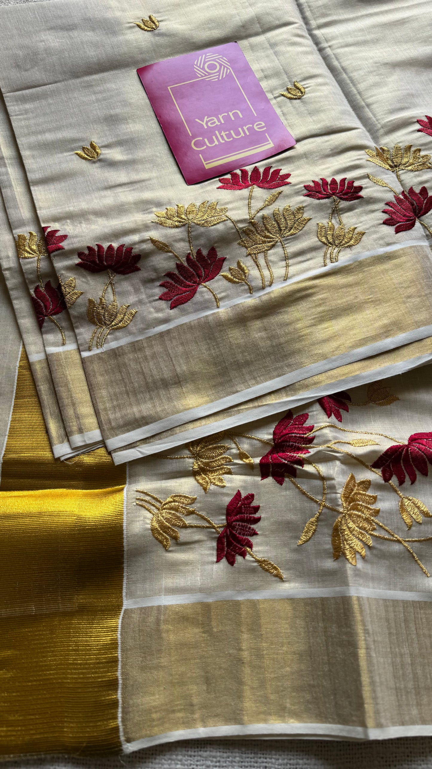 Ivory and gold tissue kerala cotton saree with maroon and gold lotus embroidery - YCIEKCFE316