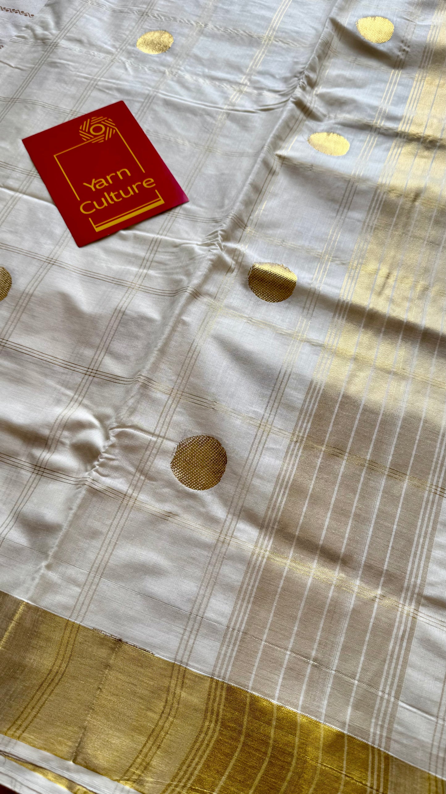 Ivory and gold kerala saree with gold buttas and checks - YCIEON41