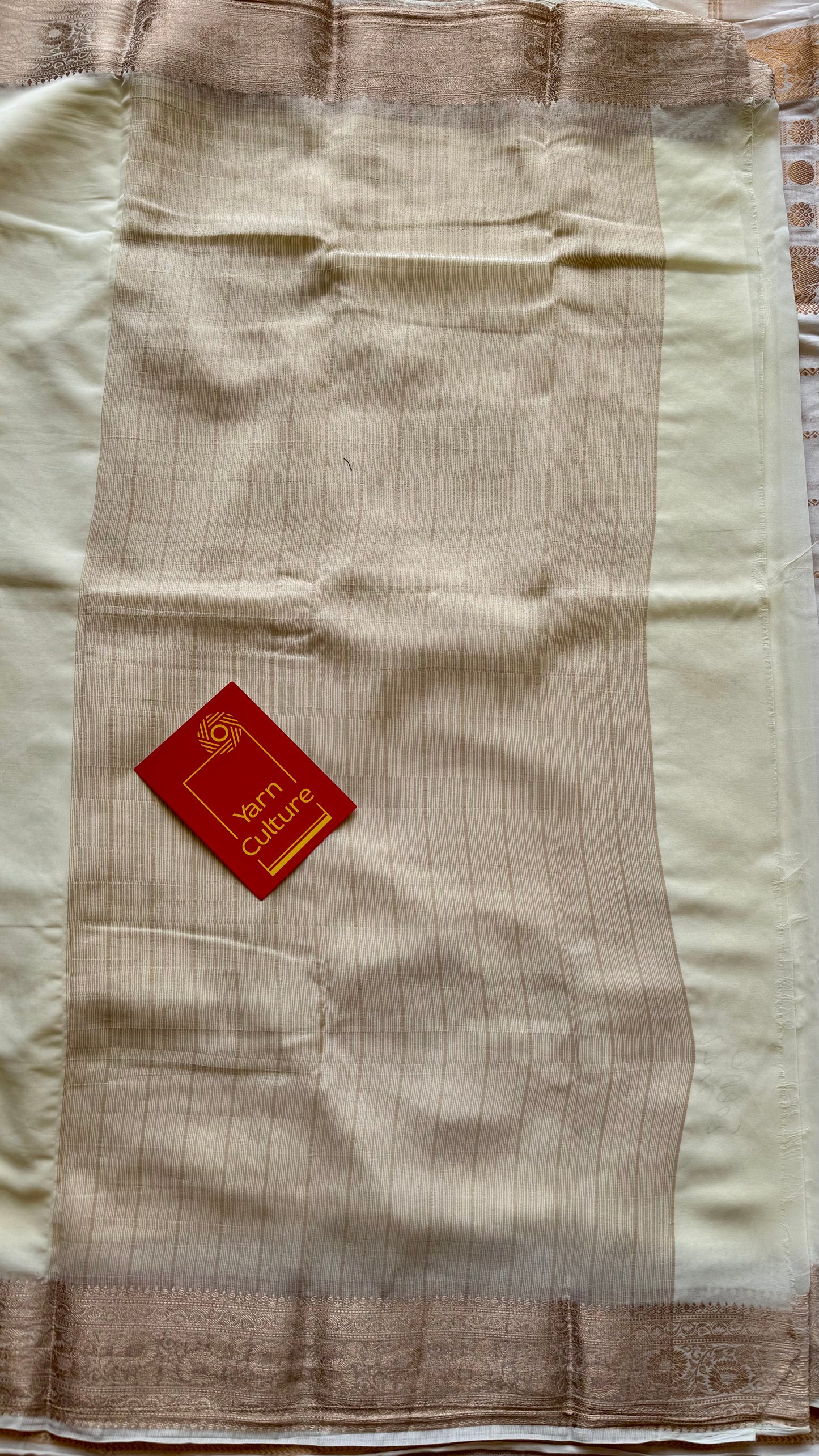 Ivory soft georgette saree, with antique gold zari border - YCIEON87