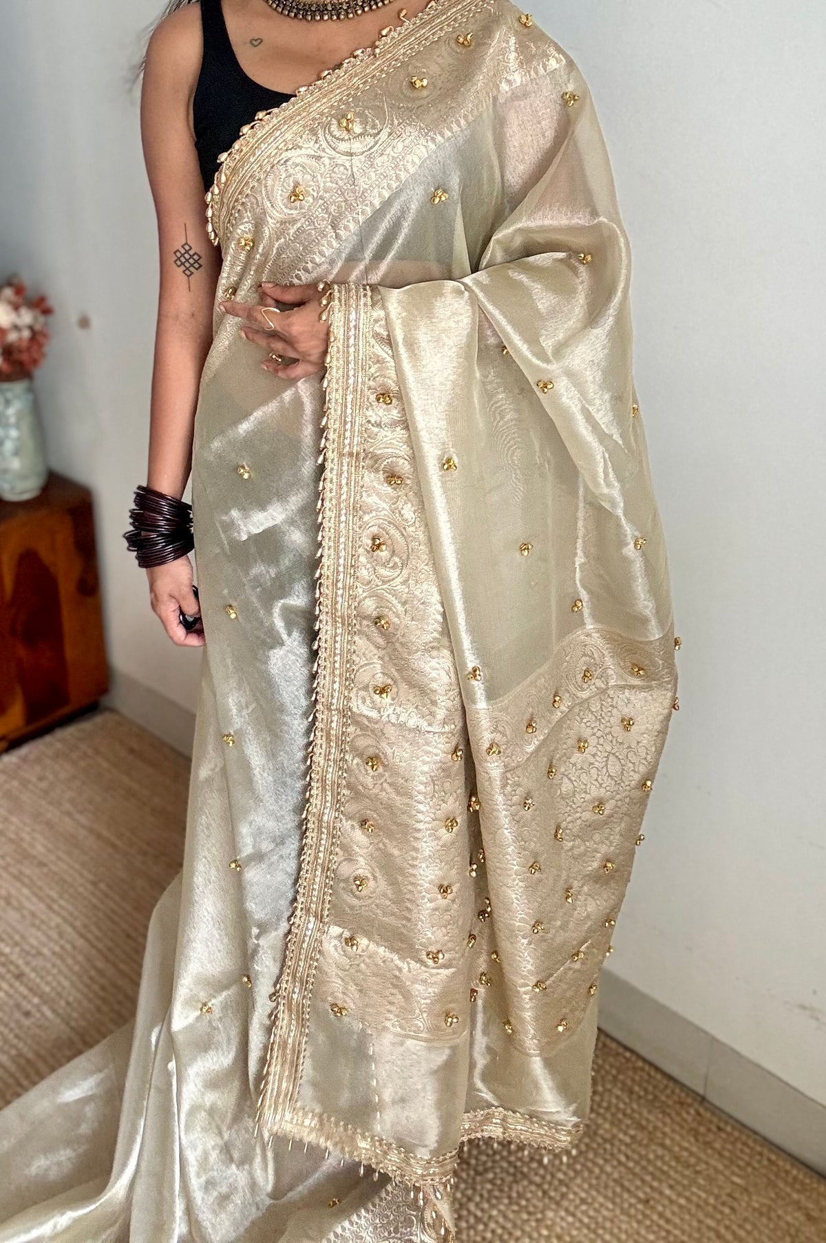 Ivory gold tissue Banarasi saree with ghungroo embellishments and beaded lace zari border - YCBLTOC70