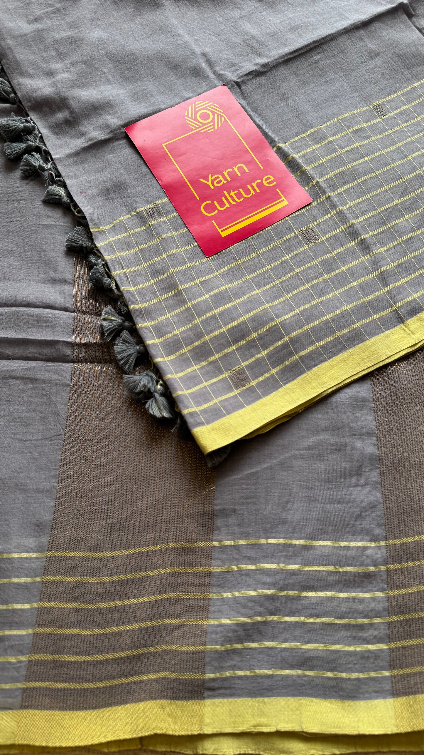 Grey handloom mul saree with custard yellow checkered borders and antique gold buttas - YCBCMCFE387