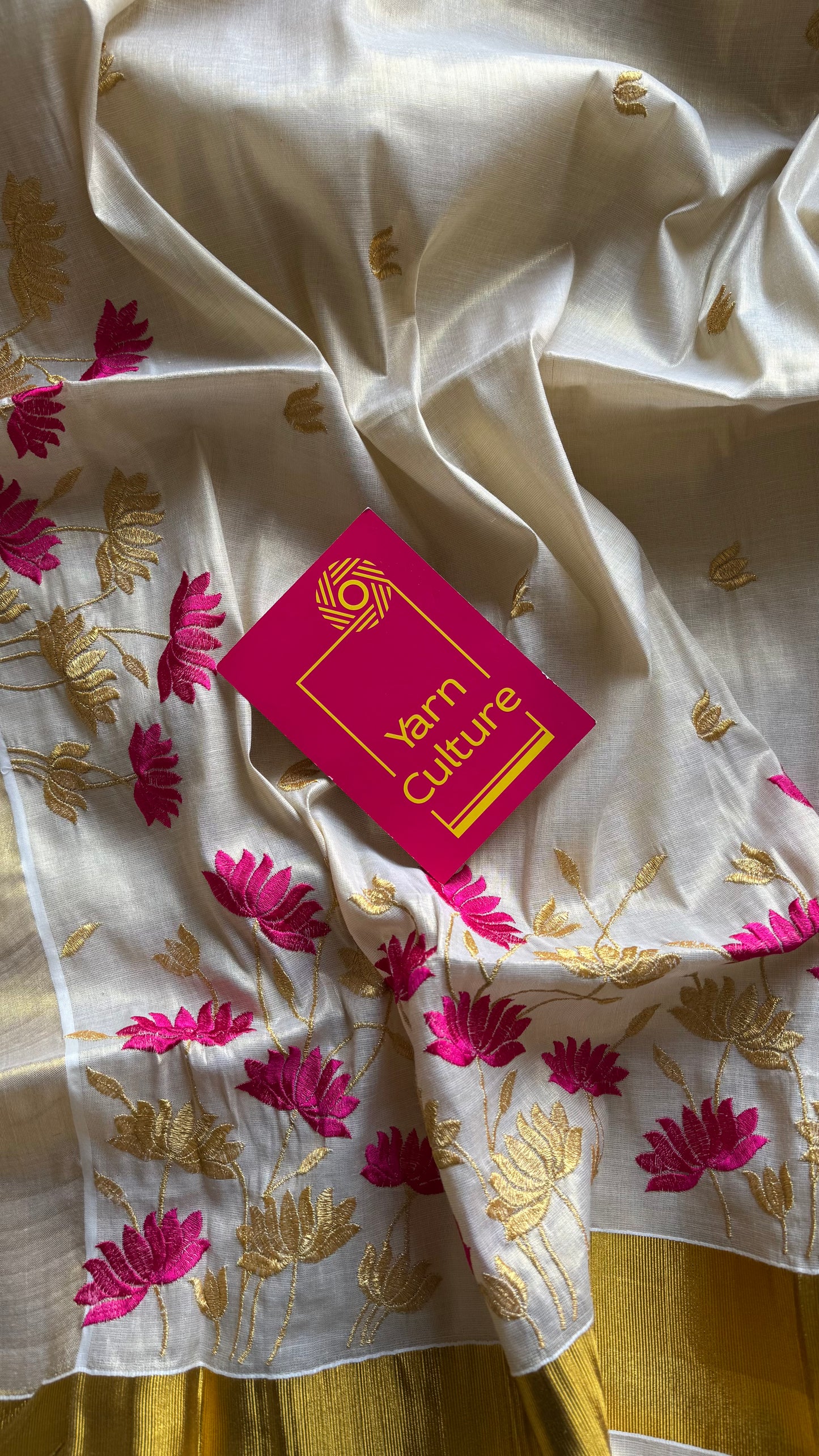 Ivory and gold tissue kerala cotton saree with hot pink and gold lotus embroidery - YCIEKCFE315