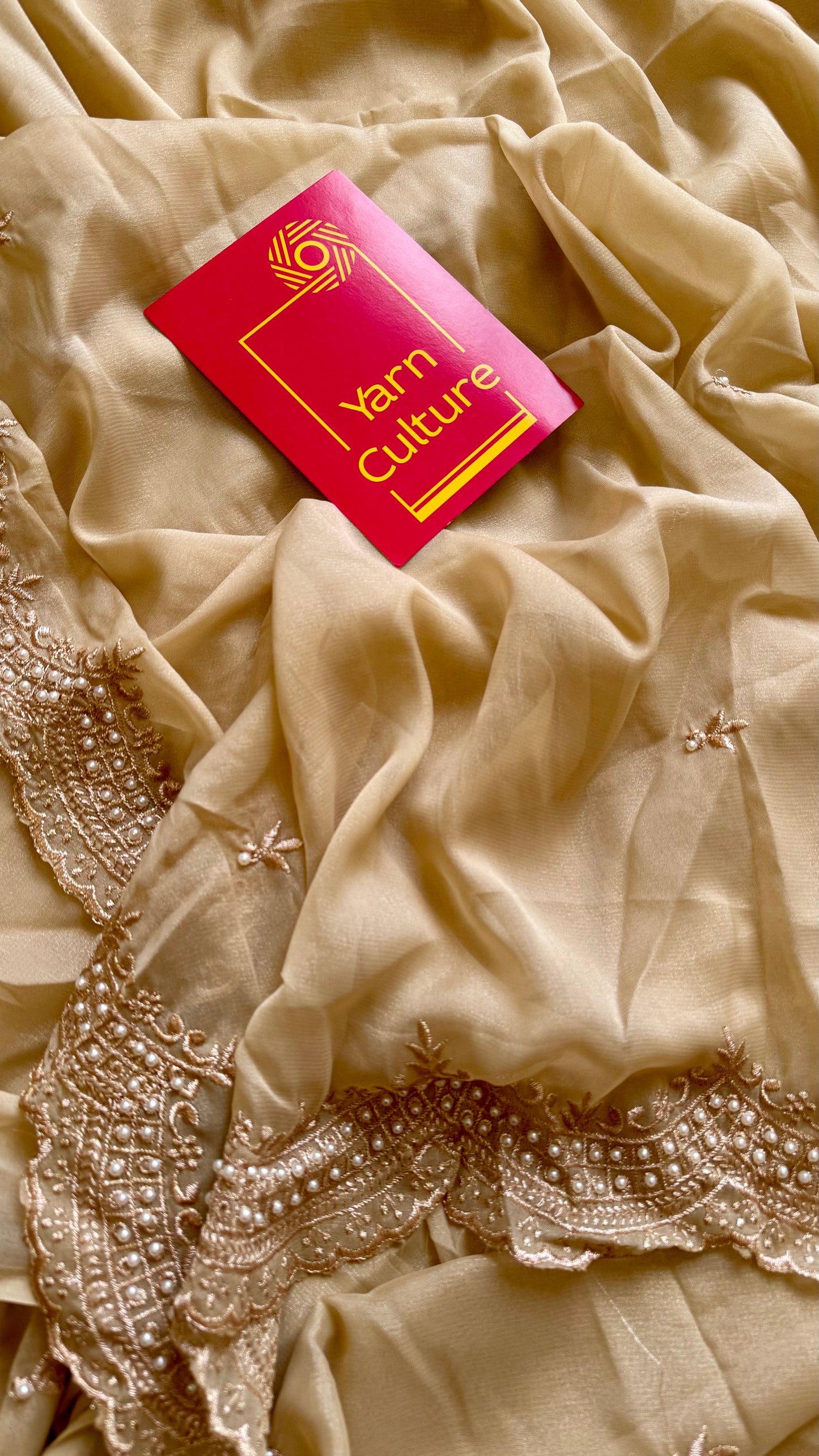 Gold soft chiffon saree, with pearl embellished border - YCIEON85