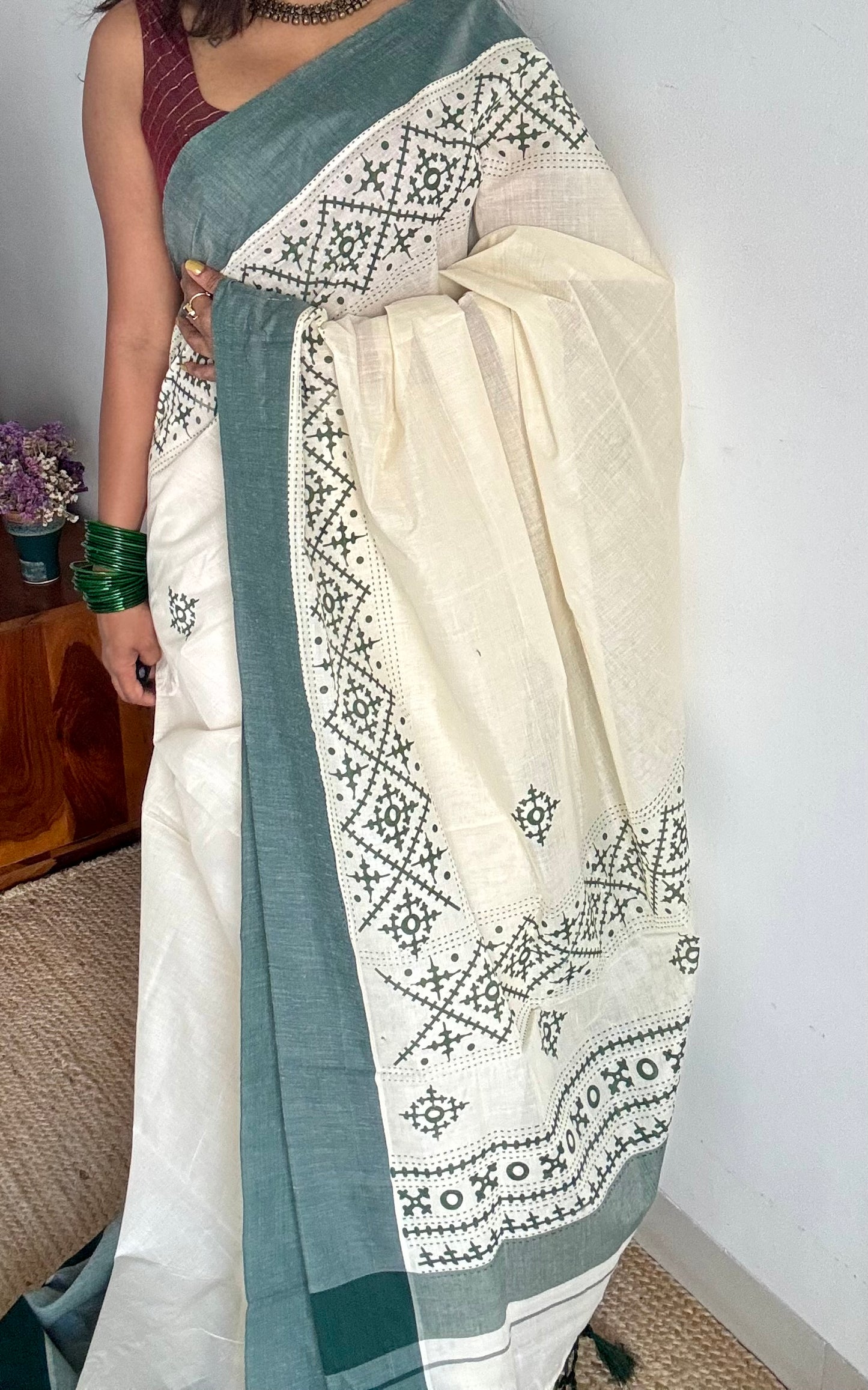 Ivory Kerala cotton saree with green Kutch-inspired printed borders and green centre pleats - YCIEKCFE314