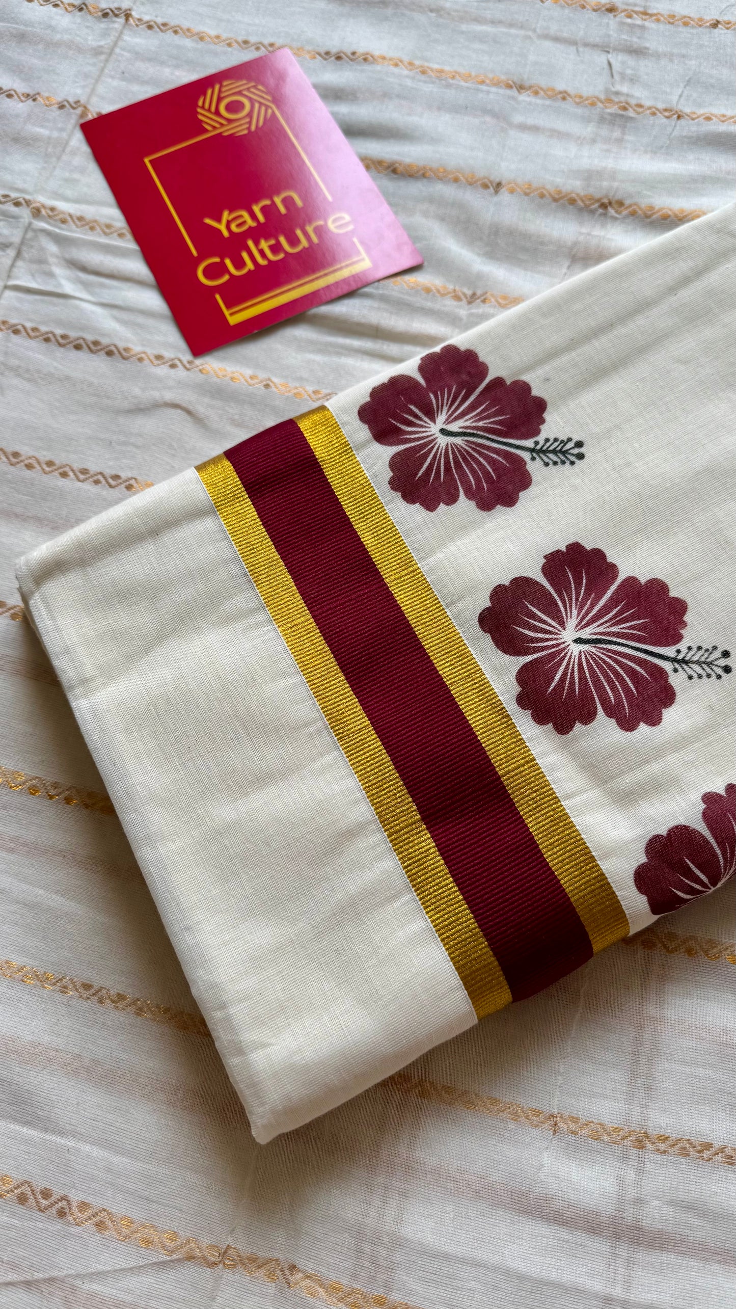 Ivory and gold soft cotton saree, maroon hibiscus (chembarathi) flowers - YCIEON62