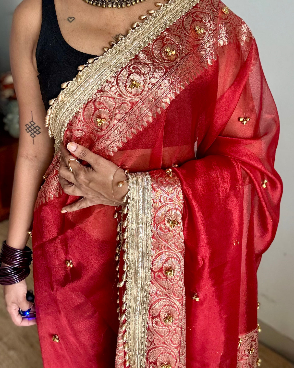 Red gold tissue Banarasi saree with ghungroo embellishments and beaded lace zari border - YCBLTOC69