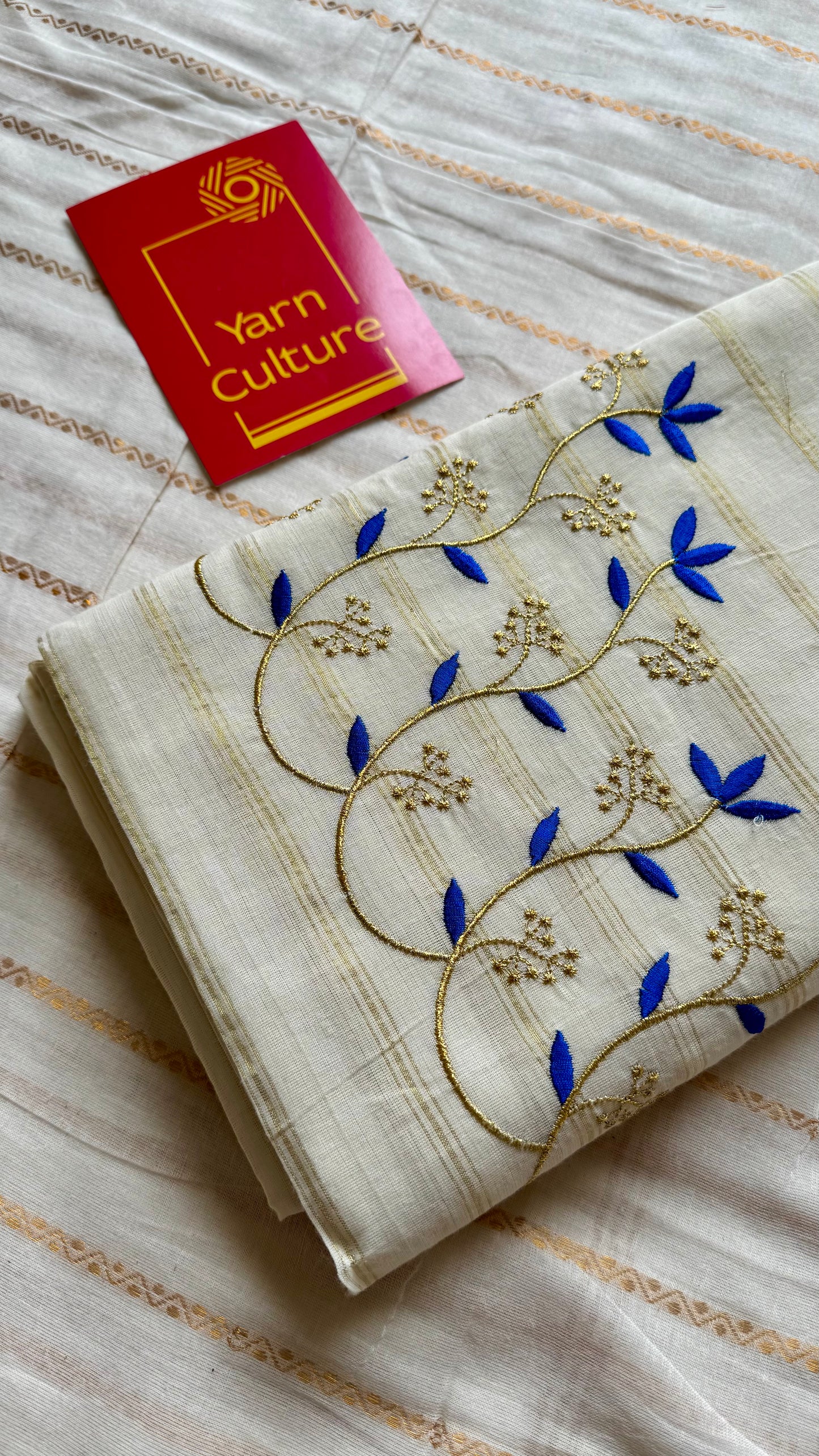 Ivory and gold soft cotton saree, blue floral vine embroidery  - YCIEON55