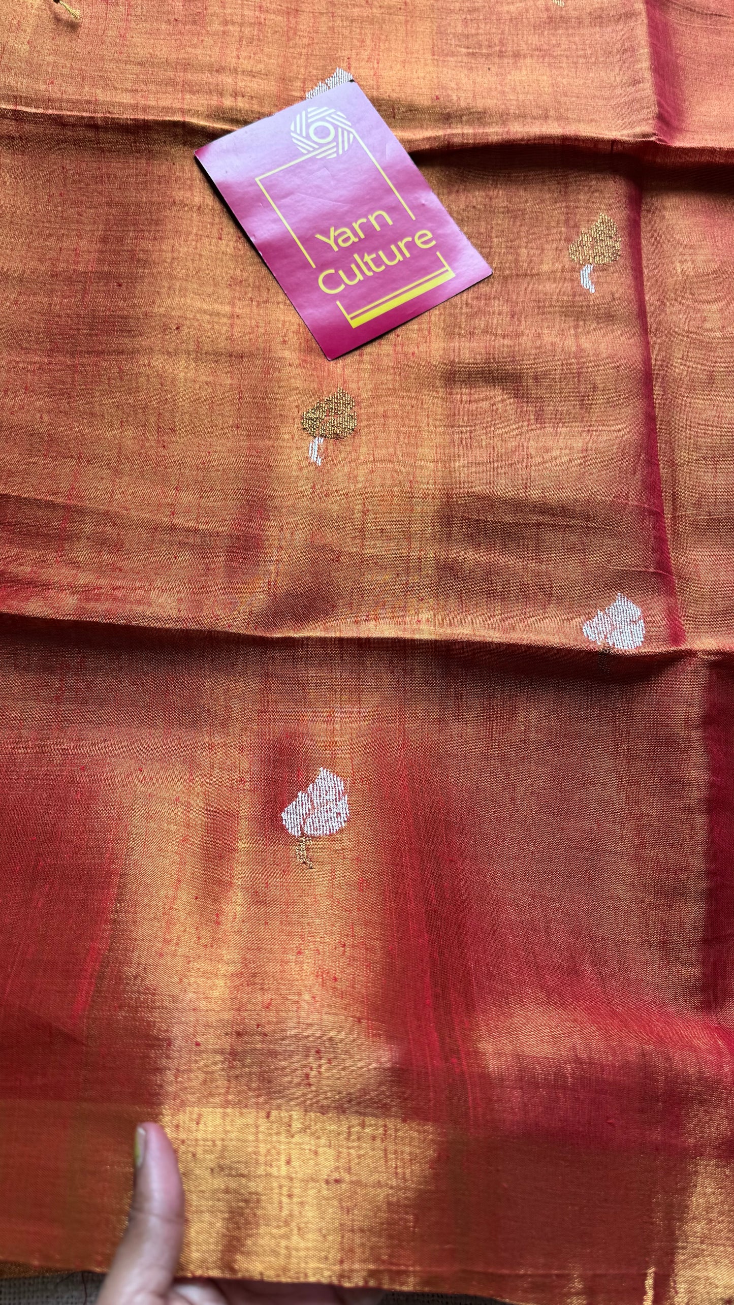 Handwoven orange gold dual tone tissue linen saree with lotus motifs - YCBCLTFE399