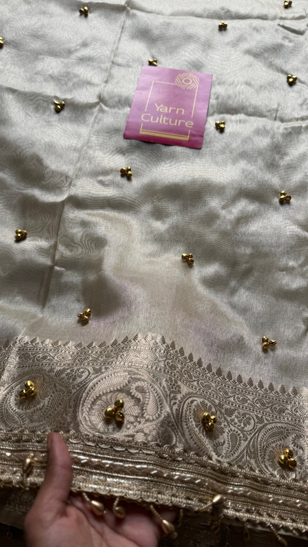 Ivory gold tissue Banarasi saree with ghungroo embellishments and beaded lace zari border - YCBLTOC70