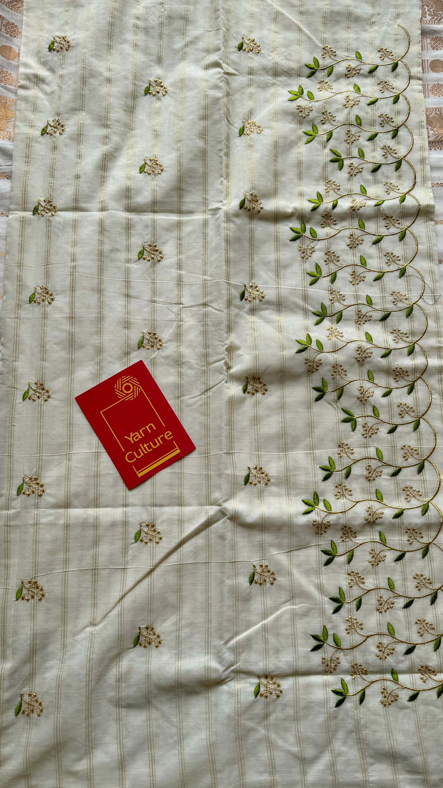 Ivory and gold soft cotton saree, light green floral vine embroidery - YCIEON59