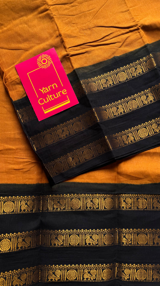 Turmeric yellow with black border, peacock and rudraksham motif, madurai soft cotton - YCCOTNJUSC01