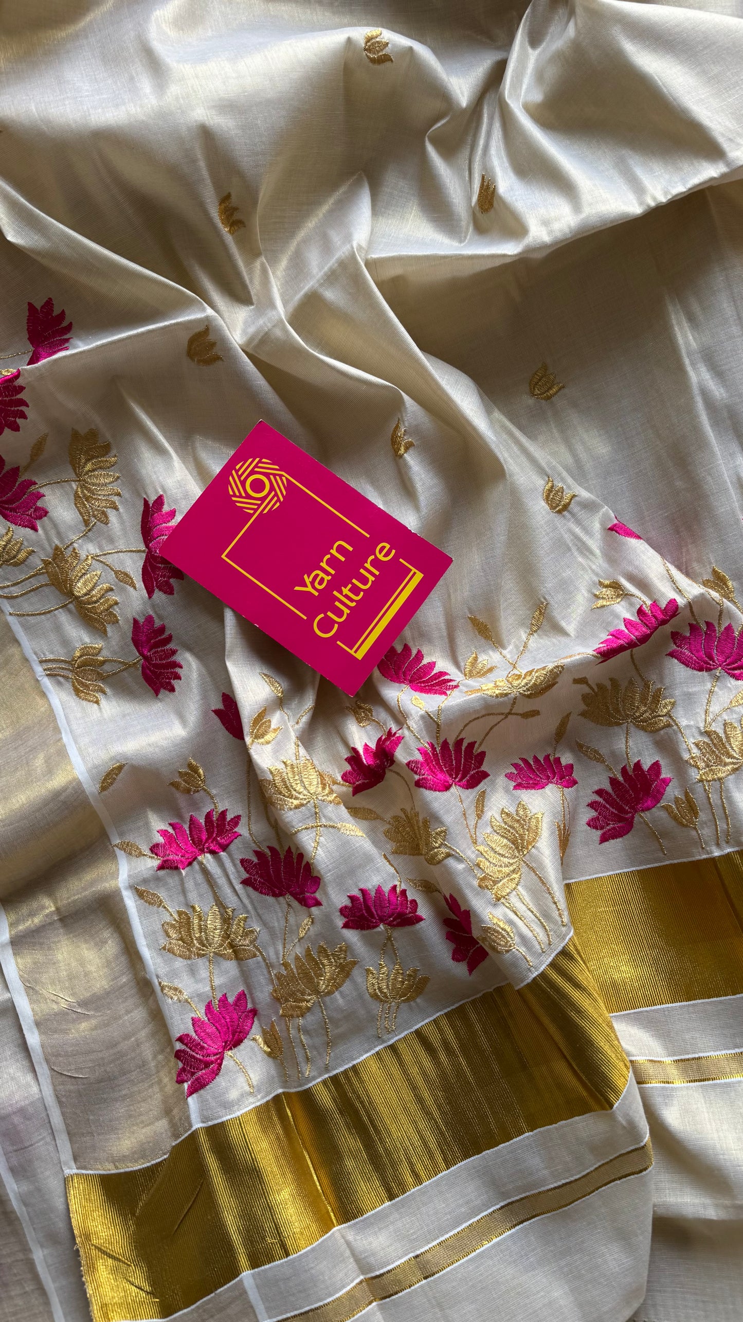 Ivory and gold tissue kerala cotton saree with hot pink and gold lotus embroidery - YCIEKCFE315