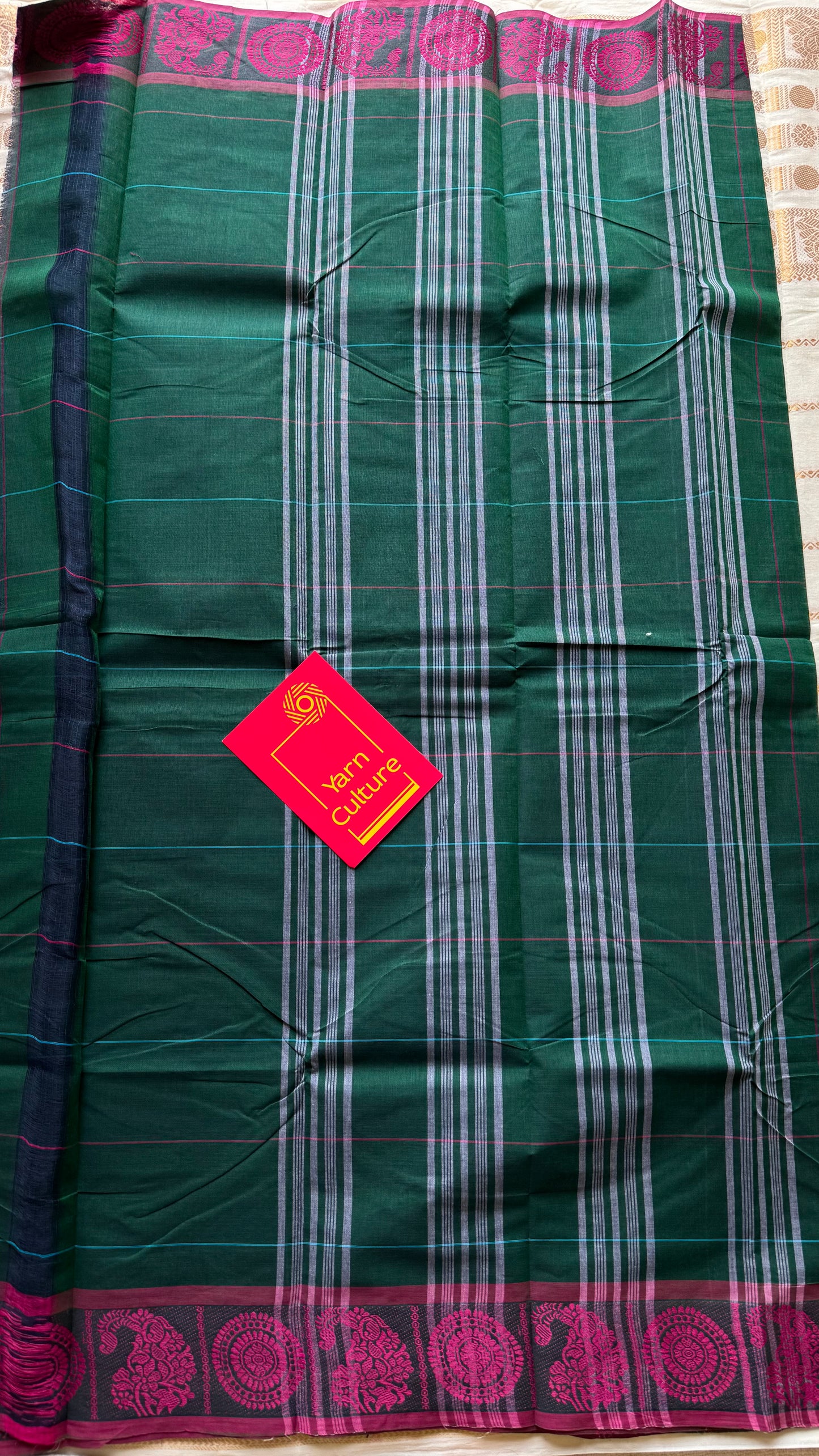 Chettinad cotton saree in dark green with pink checks, thread motif border - YCCOTNJUCC05