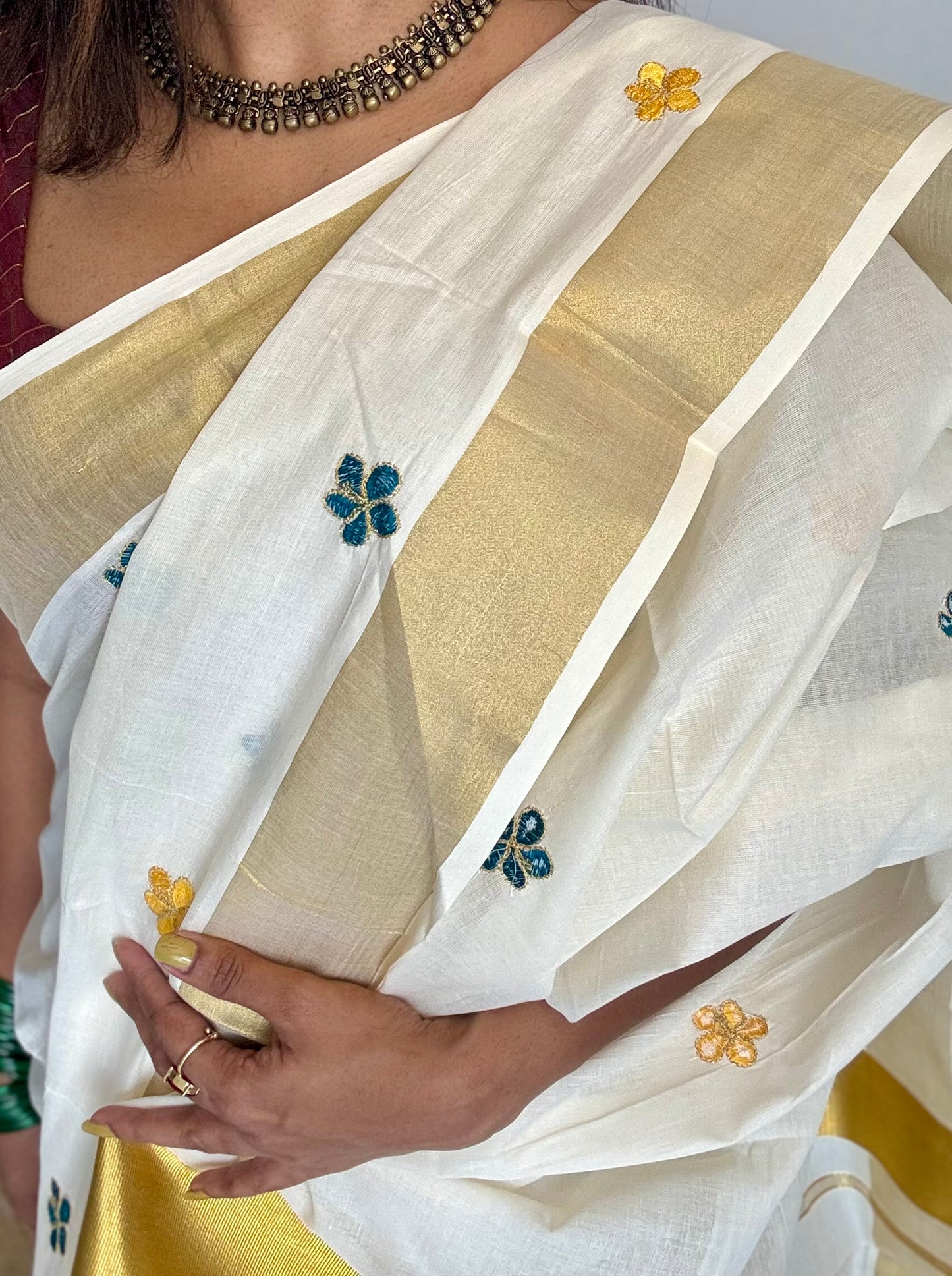 Ivory and gold saree with peacock blue and yellow floral embroidery - YCIEKCFE309