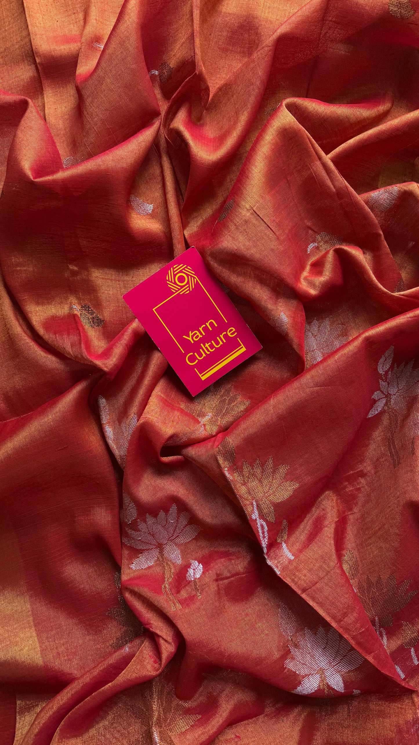 Handwoven orange gold dual tone tissue linen saree with lotus motifs - YCBCLTFE399