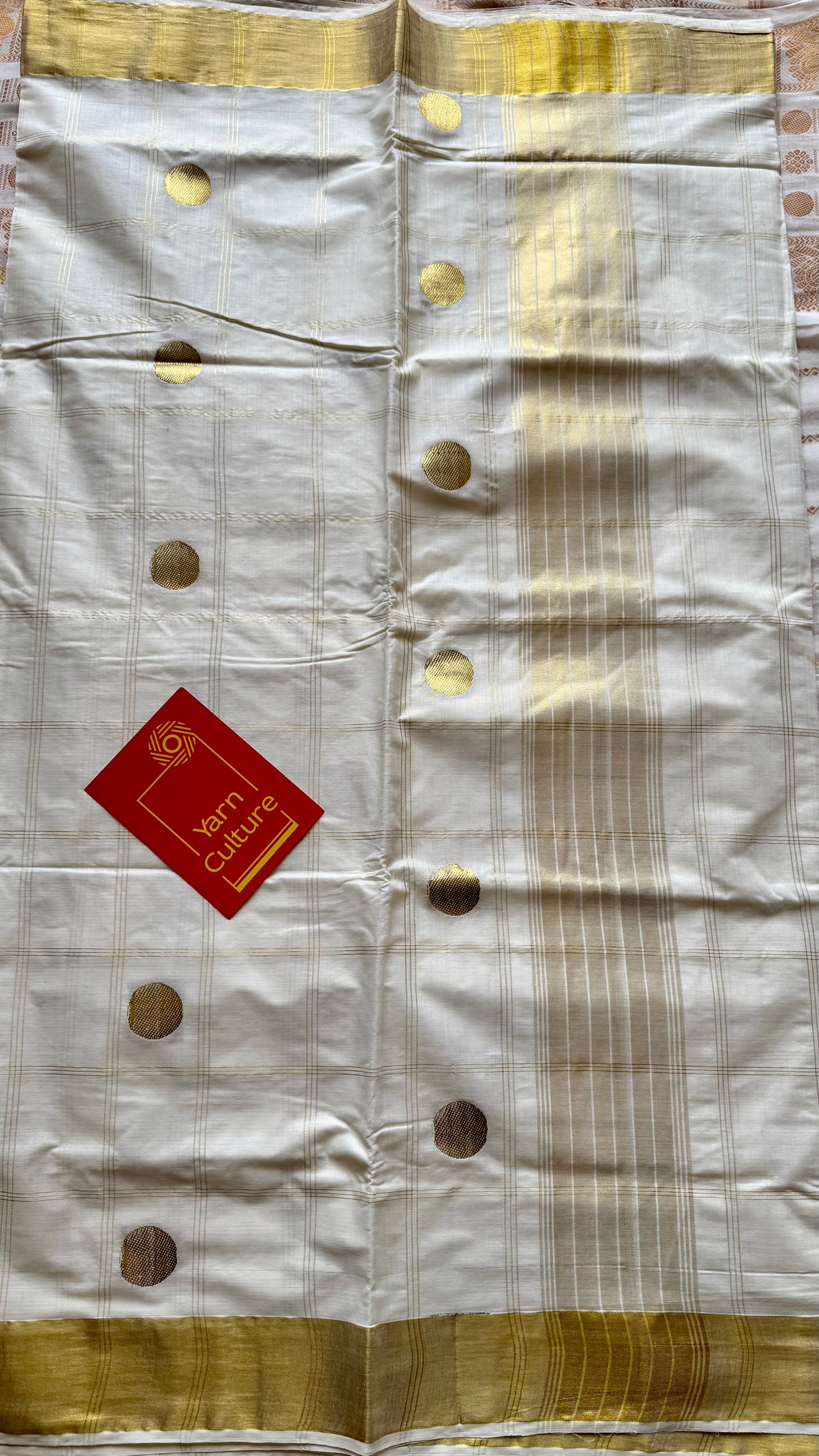 Ivory and gold kerala saree with gold buttas and checks - YCIEON41