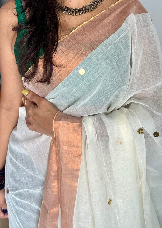 Ivory mul with gini sequins and copper zari border - YCBCMCNO60