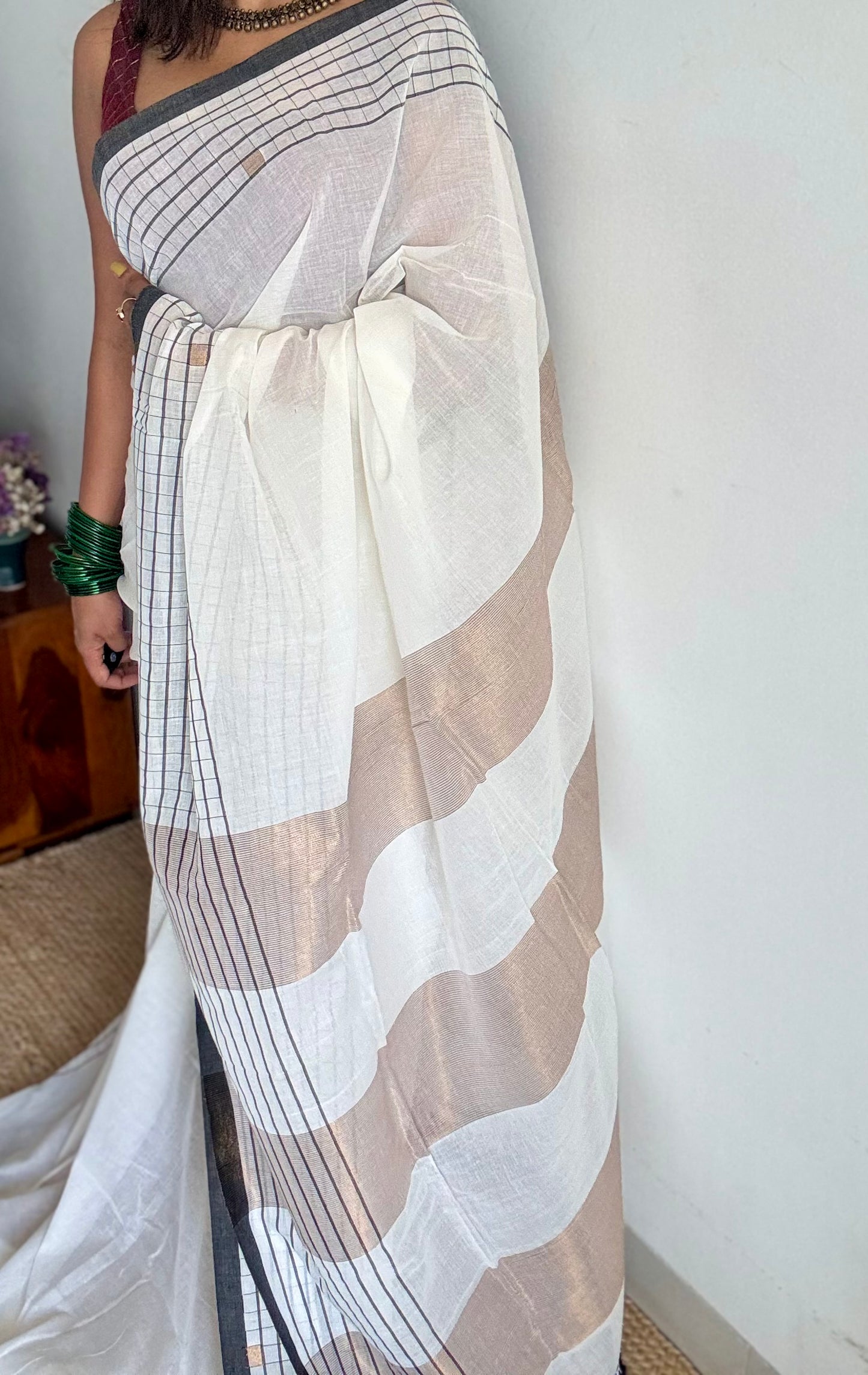 Ivory handloom mul saree with black checkered borders and antique gold buttas - YCBCMCFE170