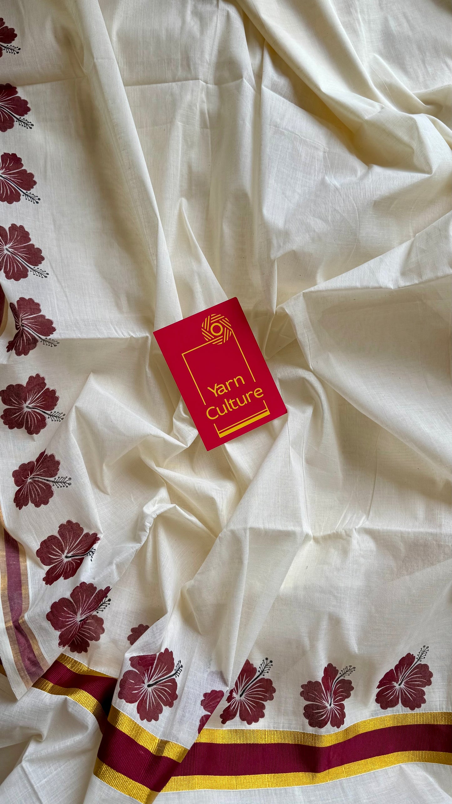 Ivory and gold soft cotton saree, maroon hibiscus (chembarathi) flowers - YCIEON62