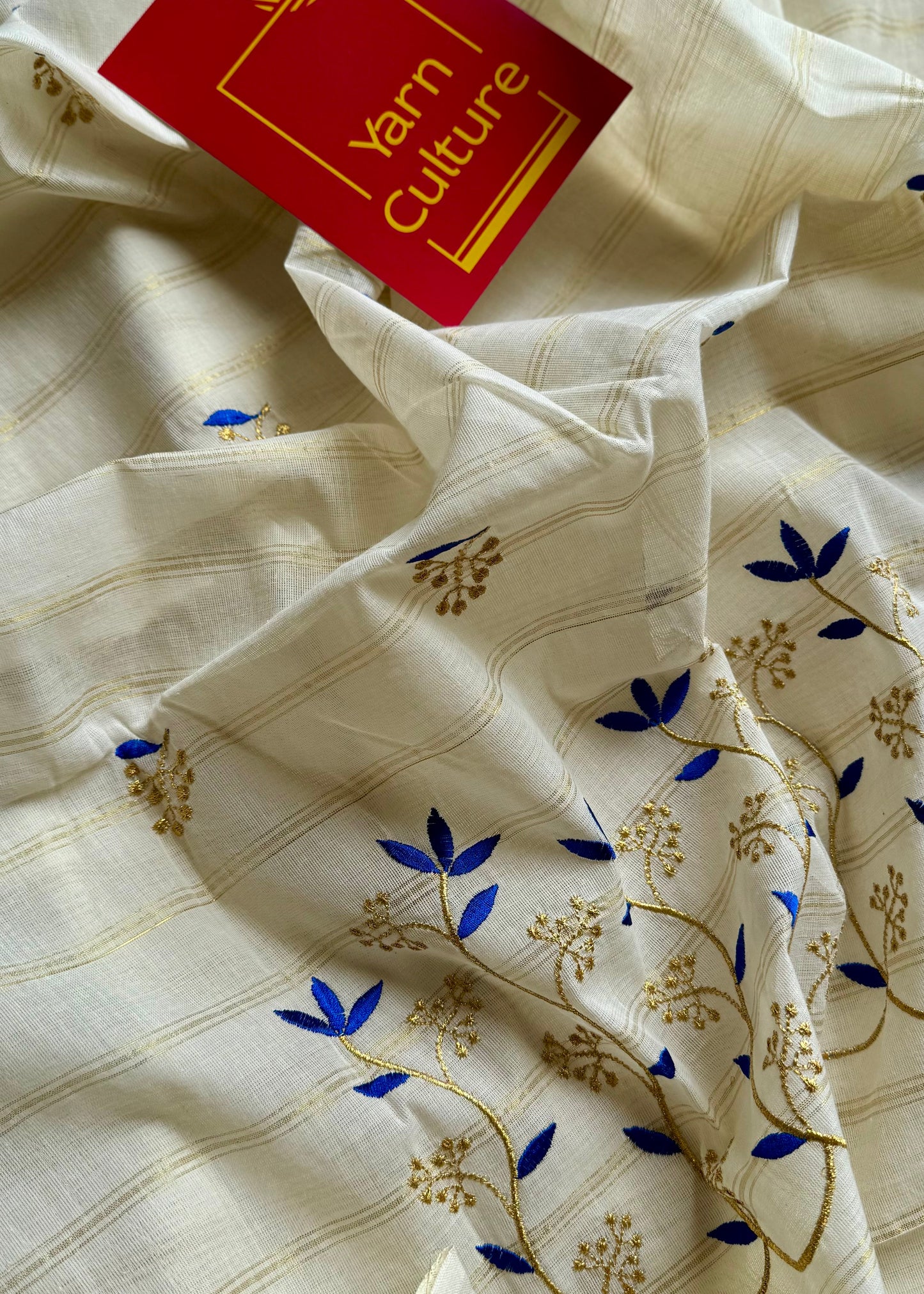 Ivory and gold soft cotton saree, blue floral vine embroidery  - YCIEON55
