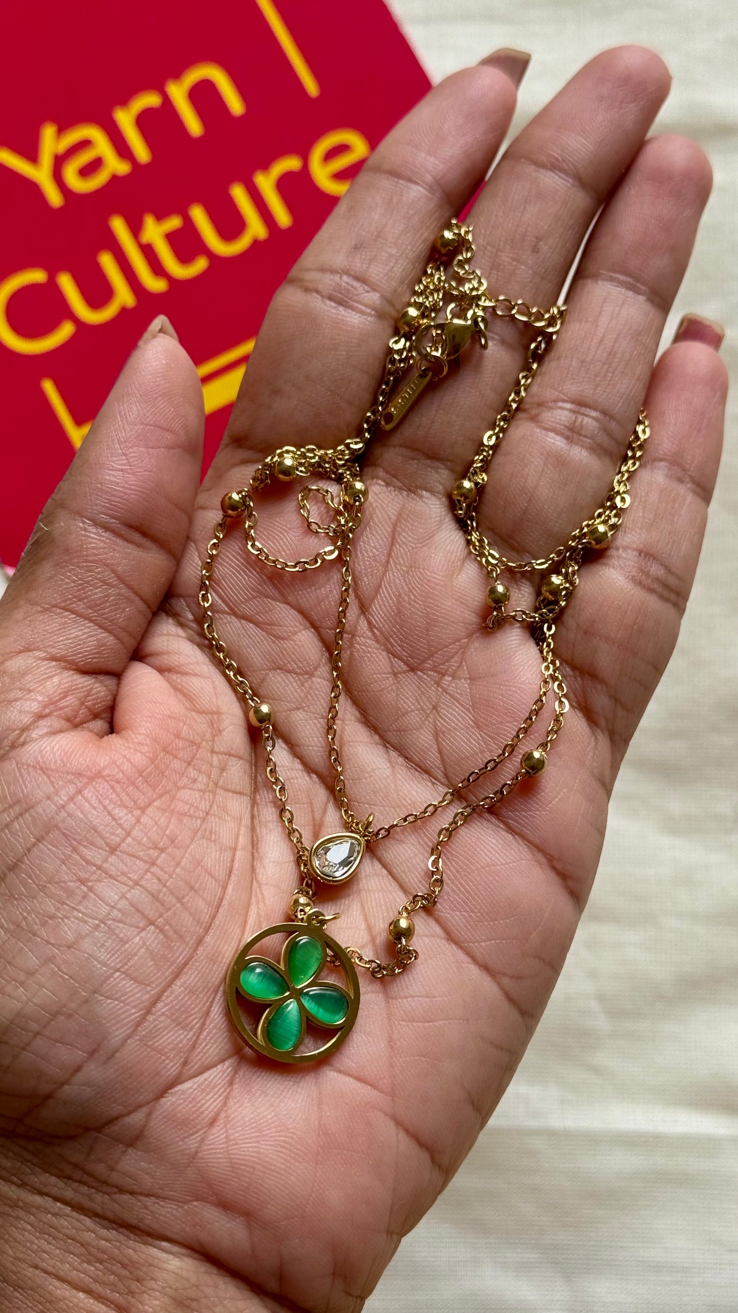 Gold plated double layered chain, green stone floral pendant - YCGPC395